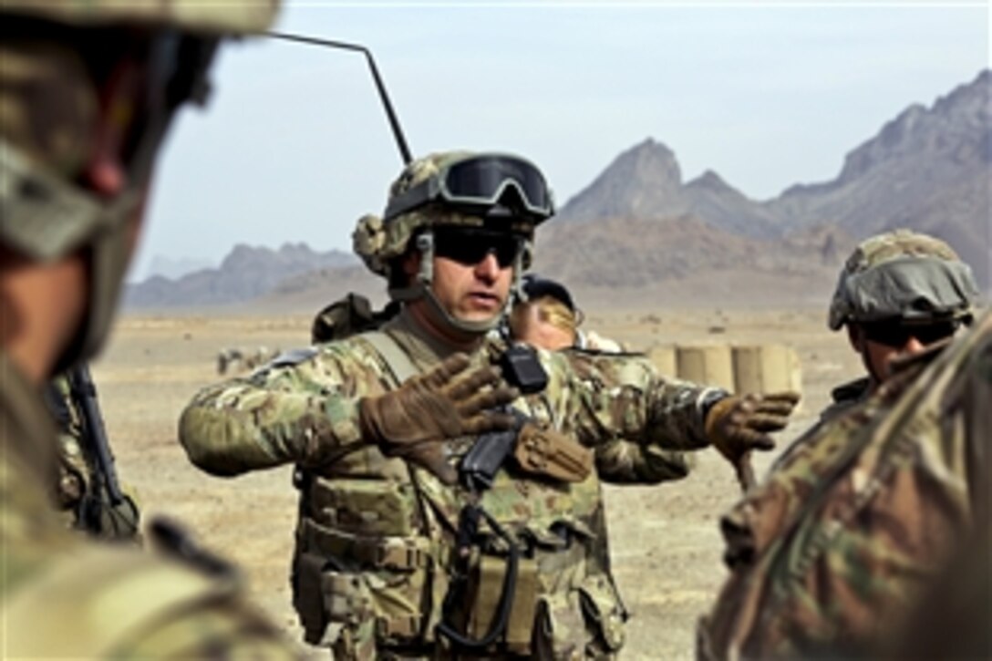 U.S. Army Sgt. 1st Class Sal Somoza, center, conducts a briefing before medical evacuation training with pilots and medics assigned to Company C, 2nd Brigade, 211th Aviation Battalion on Forward Operating Base Farah, Afghanistan, Jan. 9, 2013. Somoza, a platoon sergeant, is assigned to Provincial Reconstruction Team Farah. The team coordinated with the unit to provide the hands-on training.