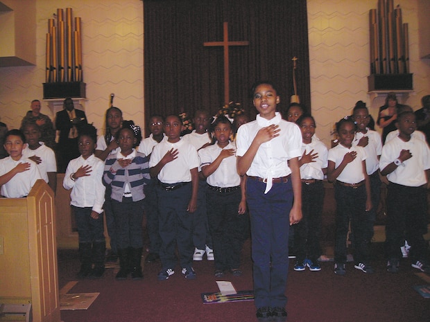 Students with the International Studies Elementary Charter School lead the Pledge of Allegiance during Marine Corps Logistics Base Albany's 2013 Dr. Martin Luther King Jr. observance.