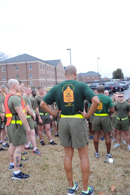 Faculty advisors speak to the Sergeants Course after a physical fitness training session on Jan. 14. The platoon of sergeants ran a 3.5-mile course to tour the base.
