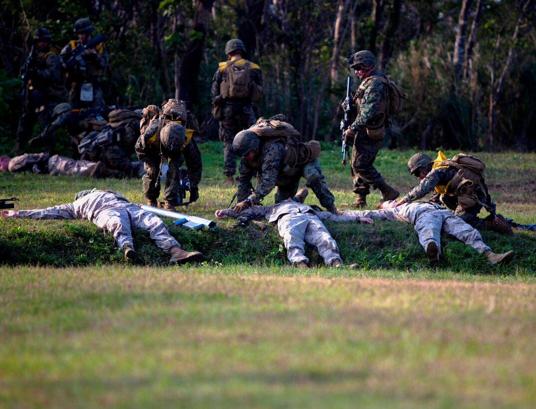 Marines and Sailors of Company A., Battalion Landing Team 1st Battalion, 5th Marine Regiment, 31st Marine Expeditionary Unit, collect simulated enemy casualties and weapons during a mechanized raid here, Jan 11. The raid was part of the 31st MEU’s pre-deployment training for the Spring Patrol 2013, where the Marines and Sailors are scheduled to participate in Exercise Cobra Gold, an annual multi-lateral exercise. The 31st MEU is the only continuously forward-deployed MEU and is the Marine Corps’ force in readiness in the Asia-Pacific region.