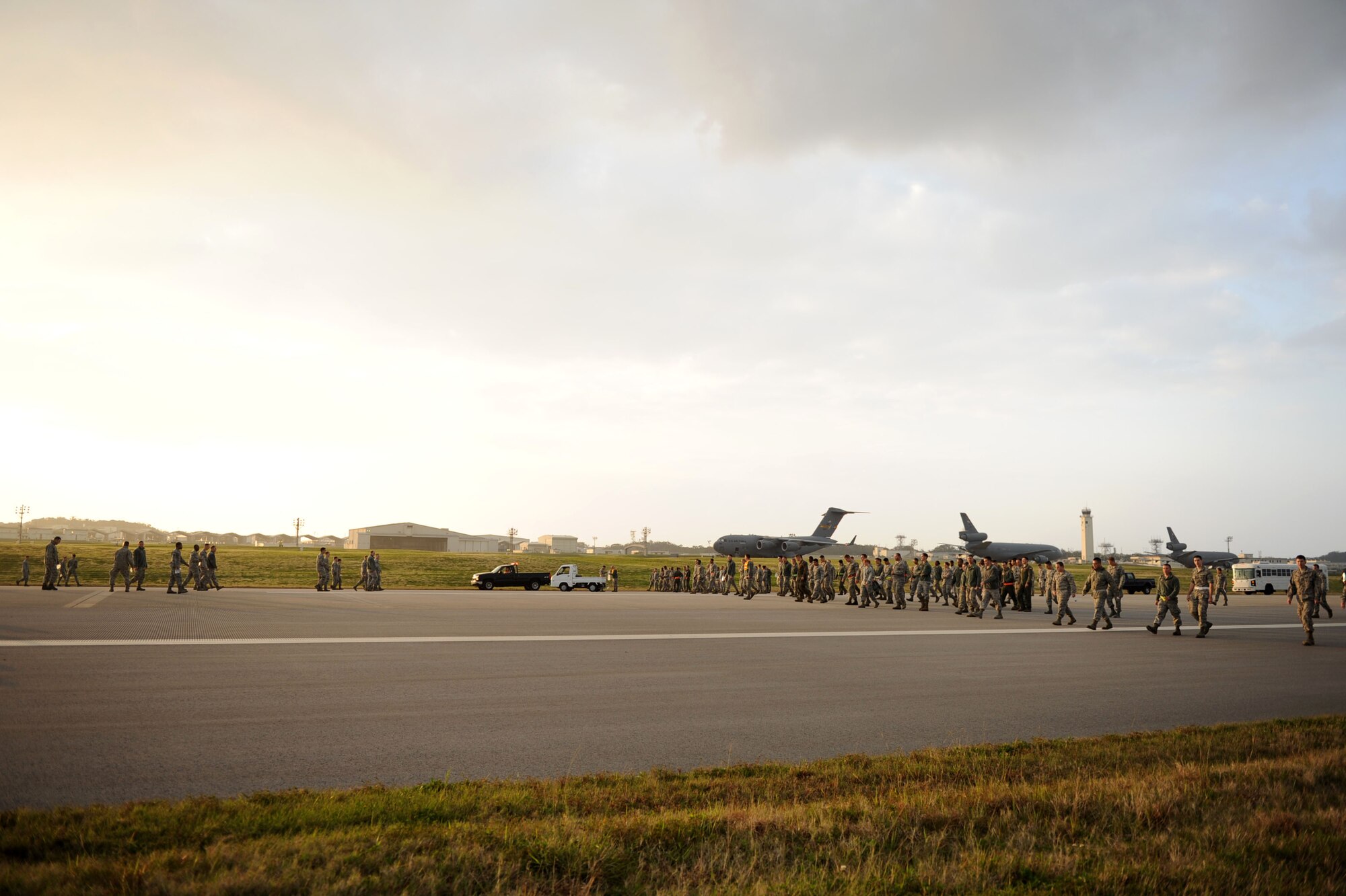 U.S. Air Force Airmen from Kadena Air Base walk along one of the runways to look for foreign objects and debris on Kadena Air Base, Japan, Jan. 14, 2013. FOD could be anything from rocks to trash blown out onto the tarmac by the wind. (U.S. Air Force photo by Airman 1st Class Brooke P. Doyle)
