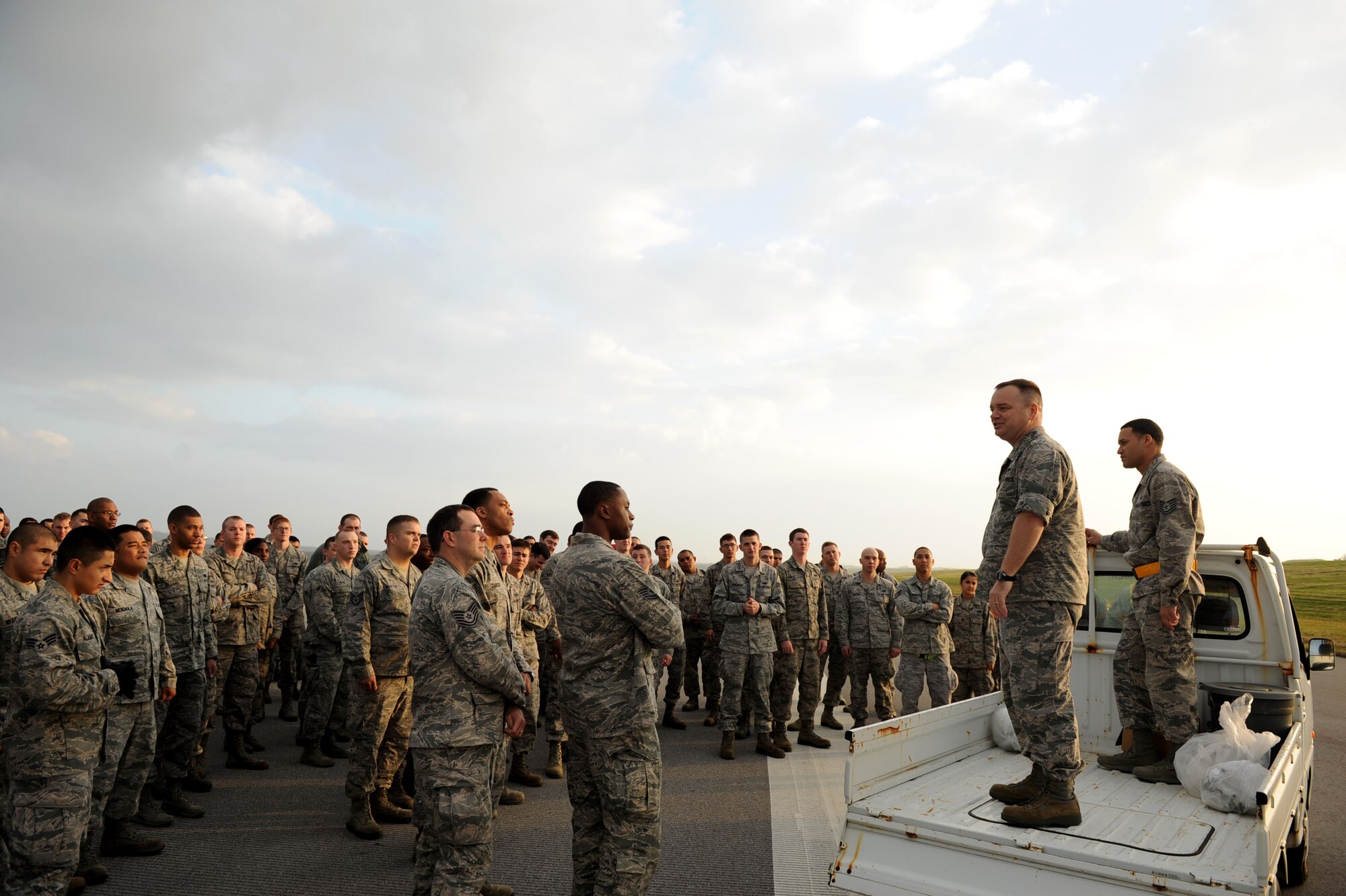 U.S. Air Force Col. Brian McDaniel, 18th Wing vice commander, speaks to a group of U.S. Air Force service members upon their completion of a sweep of a portion of the flight line for foreign objects and debris on Kadena Air Base, Japan, Jan. 14, 2013. Conducting a FOD walk will allow more eyes to look for rocks or trash that can save not only machinery but Airmen’s lives. (U.S. Air Force photo by Airman 1st Class Brooke P. Doyle)