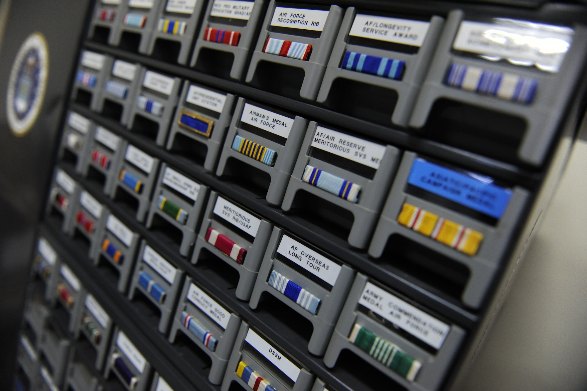 Ribbons for military uniforms are neatly organized at the U.S. Air Force Mortuary on Camp Kinser, Japan, Jan. 9, 2013. The ribbons are organized by service and the mortuary has all the ribbons dating back to World War II. (U.S. Air Force photo/ Airman 1st Class Brooke P. Doyle)