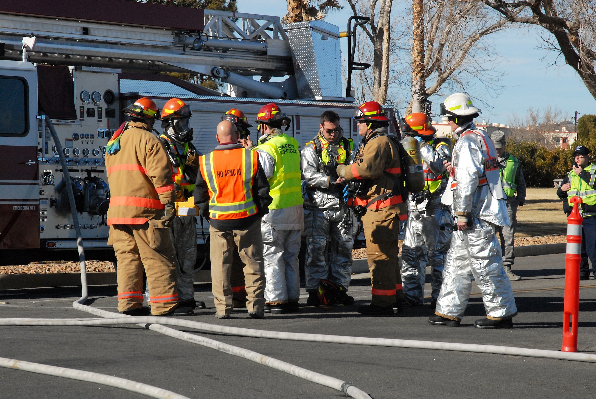 First responders from the 412th Security Forces Squadron, 412th Medical Group and Edwards AFB Fire Department responded to the simulated accident scene for the HAZMAT exercise, Jan. 15. The responders had to keep their distance due to the simulated spill of Trichlorobenzene, which is a dangerous chemical. (U.S. Air Force photo by Kenji Thuloweit)