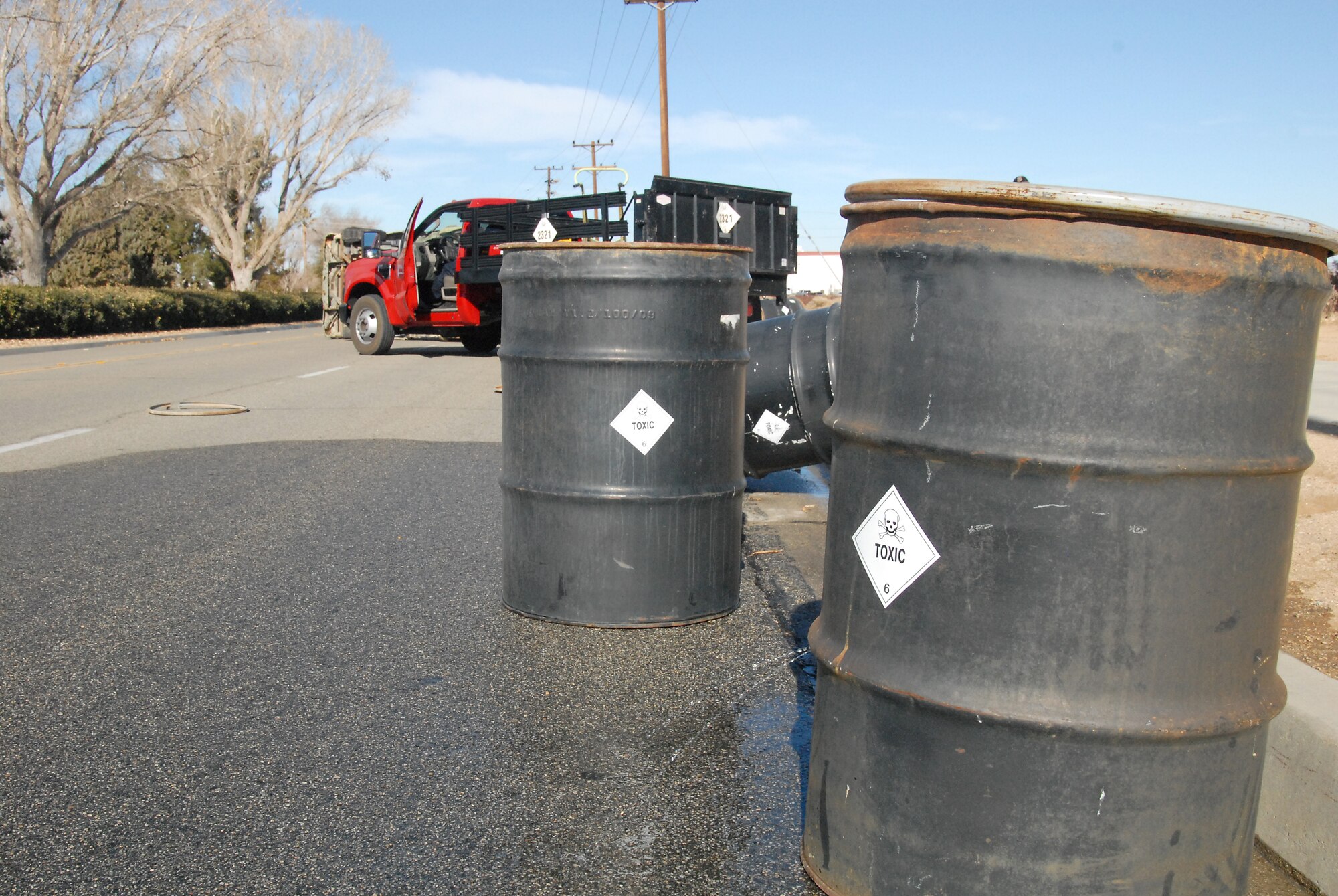 Three hundred gallons of Trichlorobenzene were spilled in the HAZMAT exercise. Members of the Edwards AFB Fire Department had to assess the accident scene before providing treatment to the vicitms.  (U.S. Air Force photo by Kenji Thuloweit)