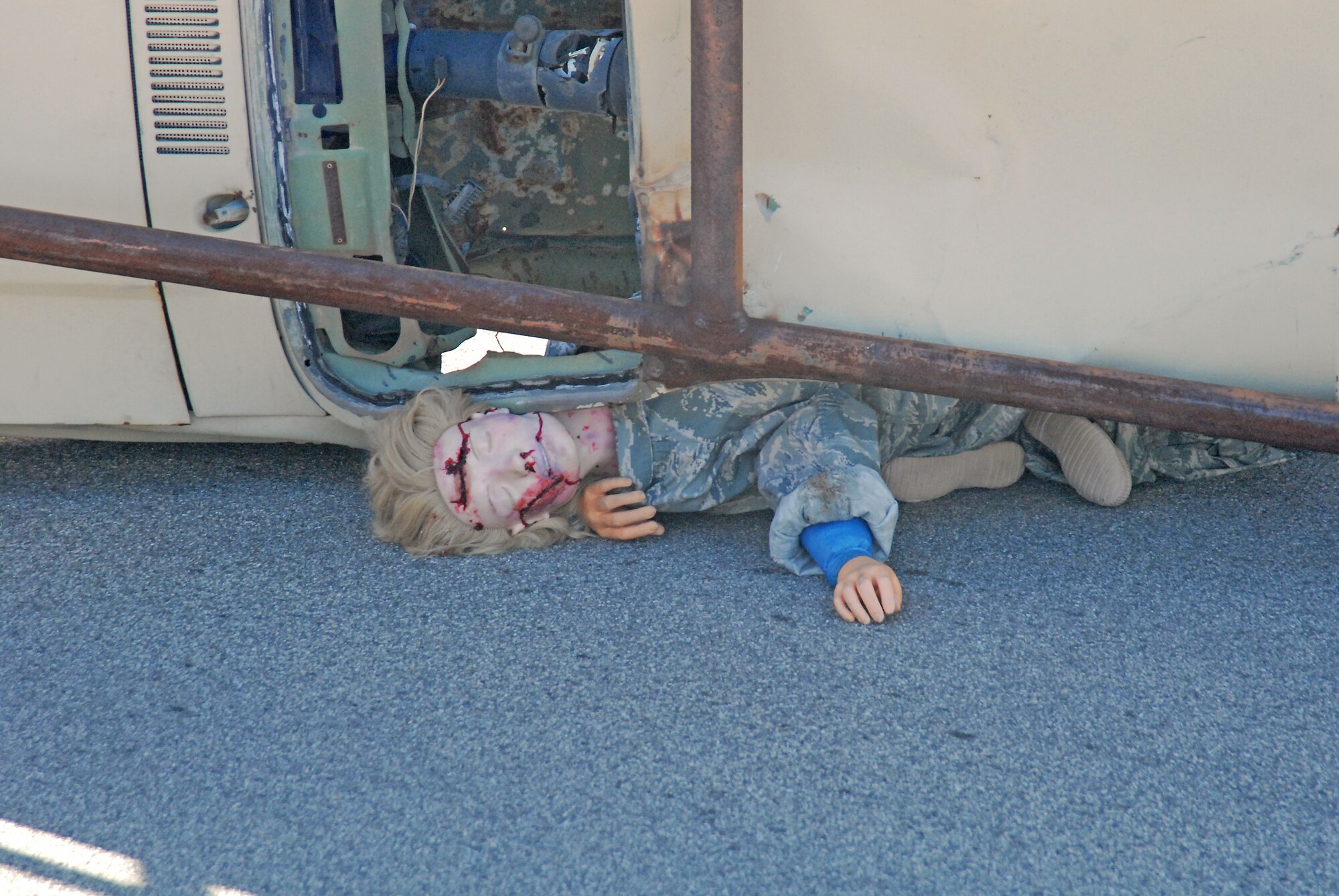 To make the exercise as realistic as possible, dummies were used to simulate victims for first responders to evaluate and treat. This "vicitm" wasn't quite so lucky, she was simulated to be dead on scene. (U.S. Air Force photo by Kenji Thuloweit)