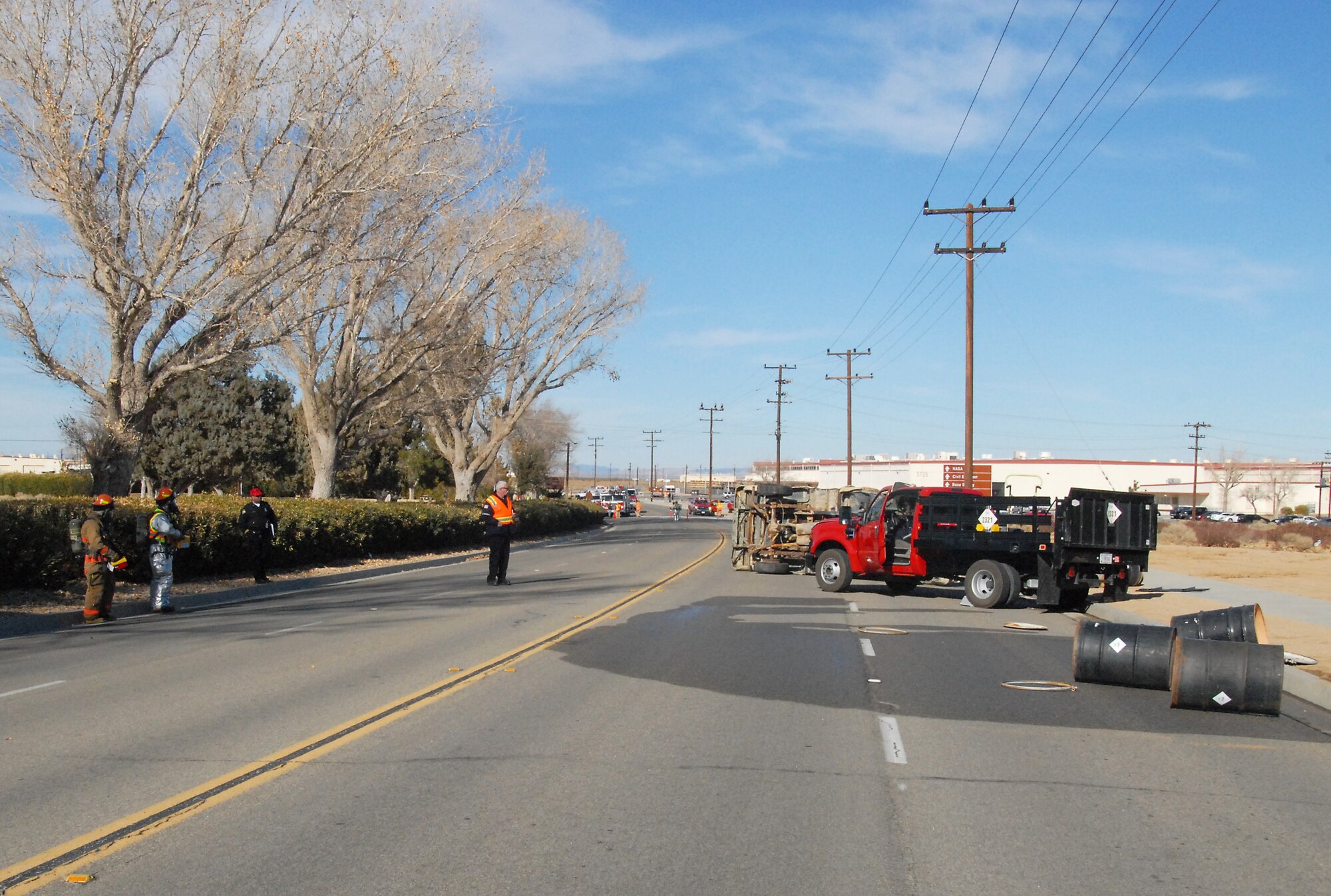 A vehicle accident scene was set up for a hazardous materials exercise Jan. 15, 2013.  The HAZMAT exercise simulated the spill of 300 gallons of the toxic chemical Trichlorobenzen following the traffic accident.  First responders including 412th Security Forces Squadron, 412th Medical Group and the Edwards Air Force Base Fire Department were evaluated by the base's Exercise Evaluation Team.  The EET members were subsequently evaluated by members of the Air Force Materiel Command Inspector General team who have been on base for a week inspecting various units and departments of the 412th Test Wing and Air Force Test Center. It is all a part of Edwards AFB's Consolidated Unit Inspection, which is scheduled to wrap up Jan. 22. (U.S. Air Force photo by Kenji Thuloweit)