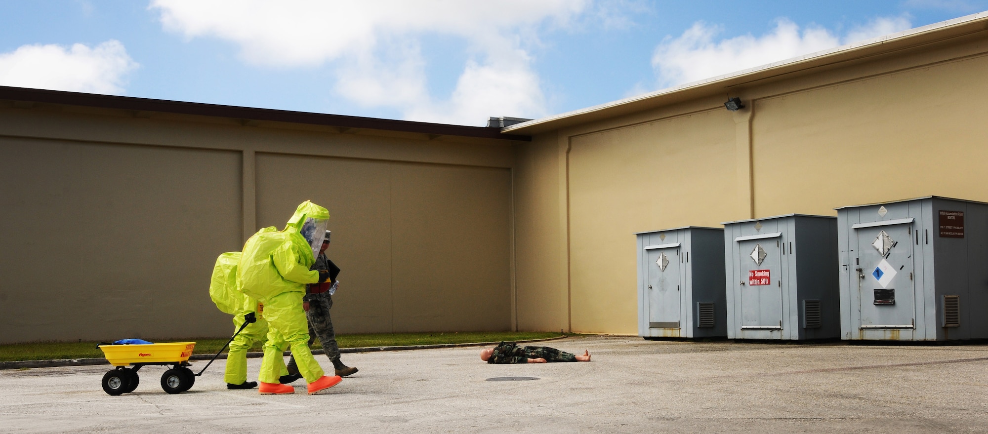 Members of 36th Medical Operations Squadron bioenvironmental engineering approach a simulated casualty during an operational readiness exercise on Andersen Air Force Base, Guam, Jan. 14, 2013. (U.S. Air Force photo by Senior Airman Carlin Leslie/Released)