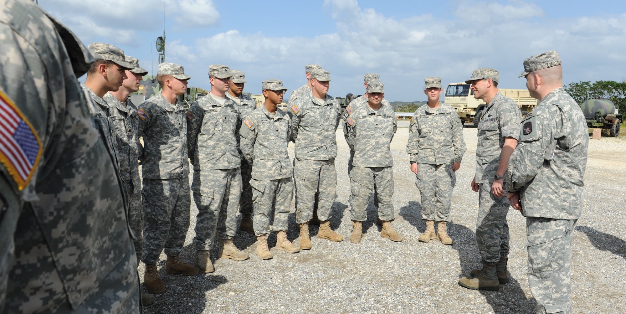 U.S. Air Force Brig. Gen. Matt Molloy, 18th Wing commander, speaks with Soldiers of the 1st Battalion 1st Air Defense Artillery Alpha Battery on Kadena Air Base, Japan, Jan. 14, 2013. The Battalion's vision is that they are trained and ready to fight and win on the modern battlefield; a cohesive, team-oriented unit comprised of professional warriors. Molloy visited the 1-1 ADA to meet the soldiers and familiarize himself with their various sites across the base. He will also be a speaker at the St. Barbara's Day Ball Jan. 25, 2013 which is held annually to celebrate St. Barbara, the patron saint of field artillery, promote camaraderie and recognize those who have served the unit. (U.S. Air Force photo/Airman 1st Class Malia Jenkins)