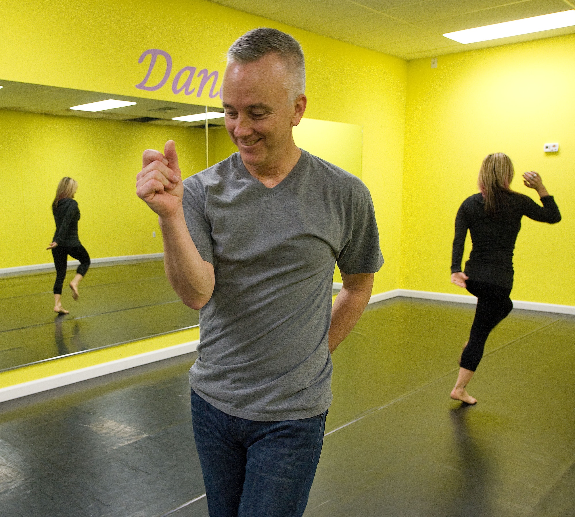 Col. Kevin Murphy, 436th Medical Group commander, dances with Shondelle Graulich at The Delaware Stage School as they practice a dance routine. Murphy and Graulich are participating in the 4th Annual Dancing with the Delaware Stars benefit dance competition being held Jan. 26, 2013. (U.S. Air Force photo by Greg L. Davis)