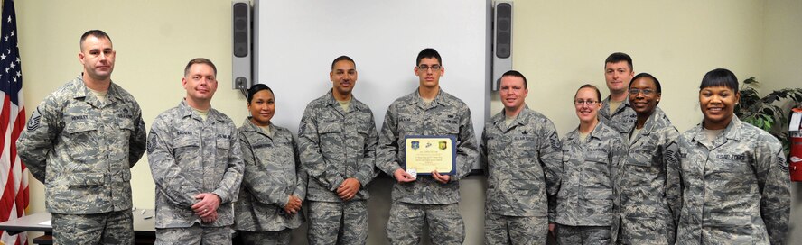MINOT AIR FORCE BASE, N.D. --  Airman 1st Class Jared Salazar, 791st Missile Security Forces Squadron member, poses with the Minot Top 3 after receiving an award here, Jan. 8. Recently, he was selected to attend the training operation in Camp Guernsey, Wyoming, known as "Road Warrior," an event which had high leadership visibility. Airman Salazar also executed 120 hours as Security Escort Team Leader and helped to safeguarded missile wing assets which ensured the continuation of the wing's mission of being safe, secure and effective 24/7/365. (U.S. Air Force photo/Senior Airman Brittany Y. Auld)