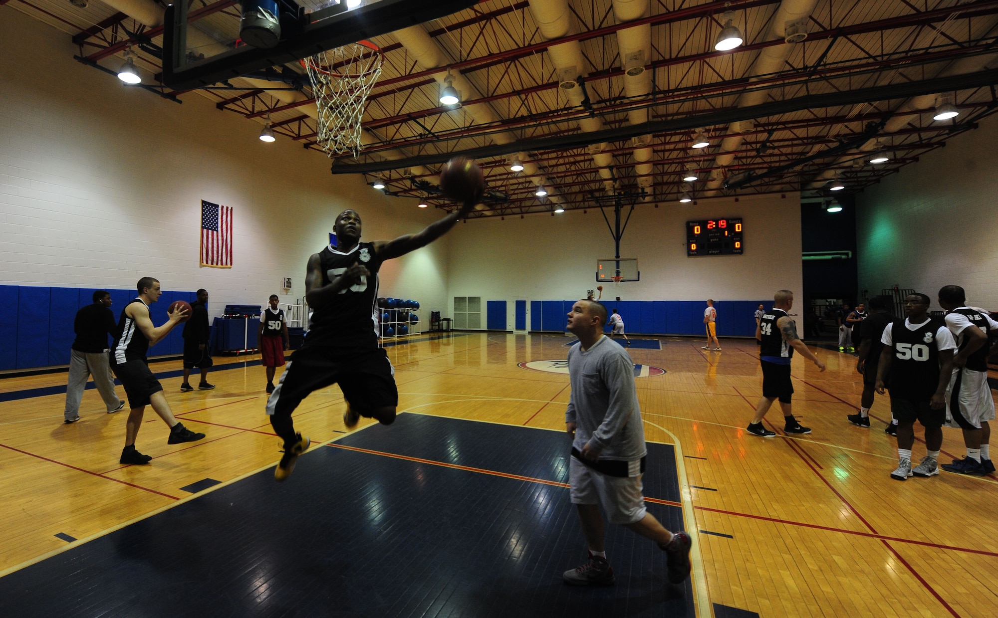 WHITEMAN AIR FORCE BASE, Mo. -- Antonio Chatman, 509th Security Forces-B intramural basketball team member, practices layup drills during his team's practice before facing the 509th Aircraft Maintenance Squadron Jan. 8. The 509th SFS-B defeated the 509th AMXS 52-42. (U.S. Air Force photo/Staff Sgt. Nick Wilson) (Released)