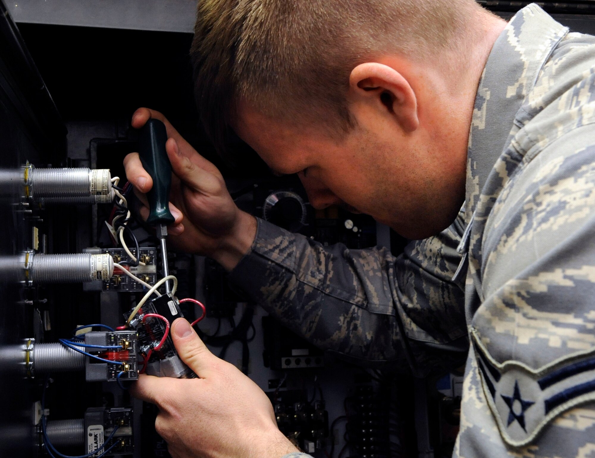 Airman 1st Class Charles Gage, 2nd Maintenance Squadron electric and environmental section, replaces a phase reversal switch on a purge unit on Barksdale Air Force Base, La., Jan. 15. Purge units heat oxygen within liquid oxygen carts up to 220 degrees to clear it of contaminants.  The E and E section maintains the electrical and life-support systems within B-52H Stratofortress bombers. (U.S. Air Force photo/Airman 1st Class Andrew Moua)