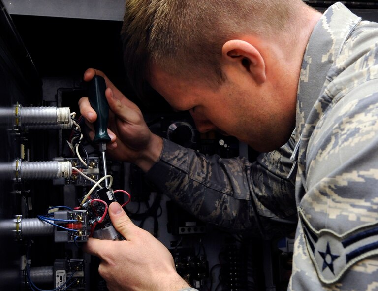 Airman 1st Class Charles Gage, 2nd Maintenance Squadron electric and environmental section, replaces a phase reversal switch on a purge unit on Barksdale Air Force Base, La., Jan. 15. Purge units heat oxygen within liquid oxygen carts up to 220 degrees to clear it of contaminants.  The E and E section maintains the electrical and life-support systems within B-52H Stratofortress bombers. (U.S. Air Force photo/Airman 1st Class Andrew Moua)