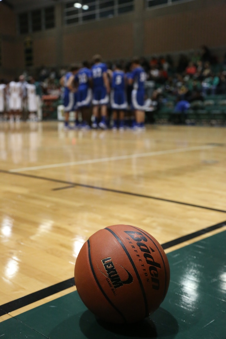 Randolph High School Ro-Hawks basketball players call a timeout in a game against the Robert G. Cole High School Cougars Jan 11. at Joint Base San Antonio-Fort Sam Houston. The Ro-Hawks have an overall record of 16-3 and a 4-1 division record. (U.S. Air Force photo by Joshua Rodriguez)