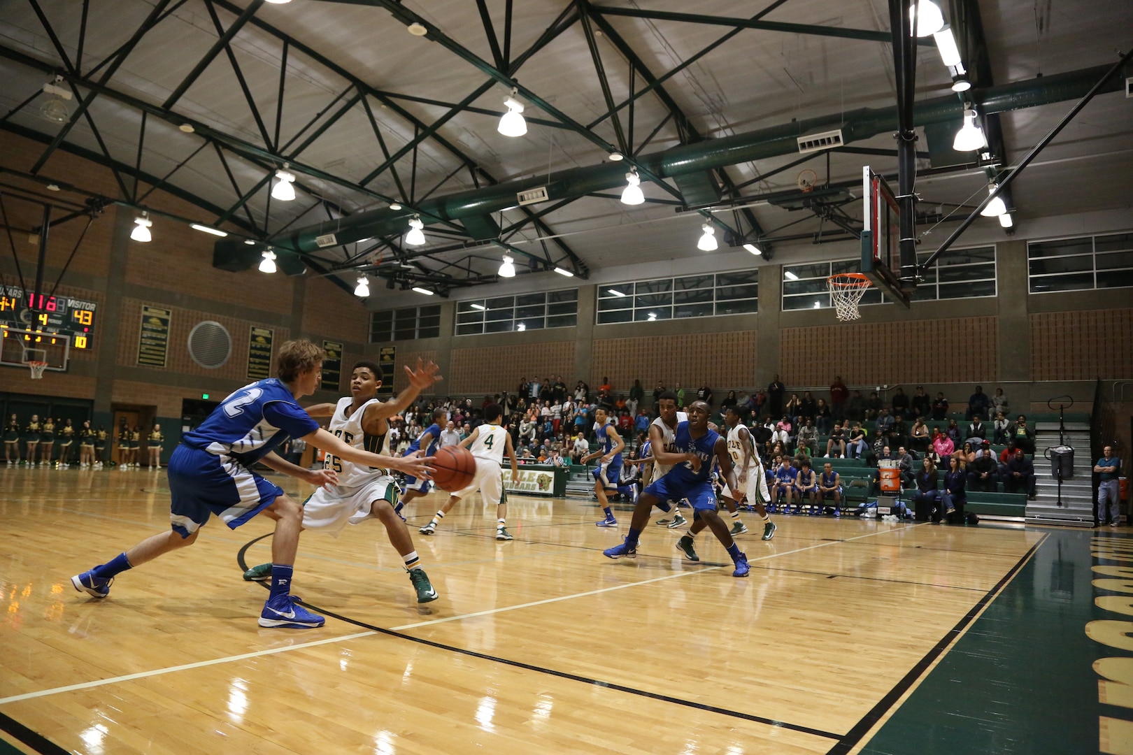 Christian Eidenschink, Randolph High School Ro-Hawks basketball player, passes the ball to his teammate, Bryan London, in a game against the Robert G. Cole High School Cougars Jan 11. at Joint Base San Antonio-Fort Sam Houston. The Ro-Hawks have an overall record of 16-3 and a 4-1 division record. (U.S. Air Force photo by Joshua Rodriguez)