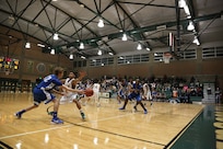 Christian Eidenschink, Randolph High School Ro-Hawks basketball player, passes the ball to his teammate, Bryan London, in a game against the Robert G. Cole High School Cougars Jan 11. at Joint Base San Antonio-Fort Sam Houston. The Ro-Hawks have an overall record of 16-3 and a 4-1 division record. (U.S. Air Force photo by Joshua Rodriguez)