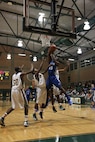 Bryan London, Randolph High School Ro-Hawks basketball player, takes a shot against the Robert G. Cole High School Cougars Jan 11. at Joint Base San Antonio-Fort Sam Houston. The Ro-Hawks have an overall record of 16-3 and a 4-1 division record. (U.S. Air Force photo by Joshua Rodriguez)