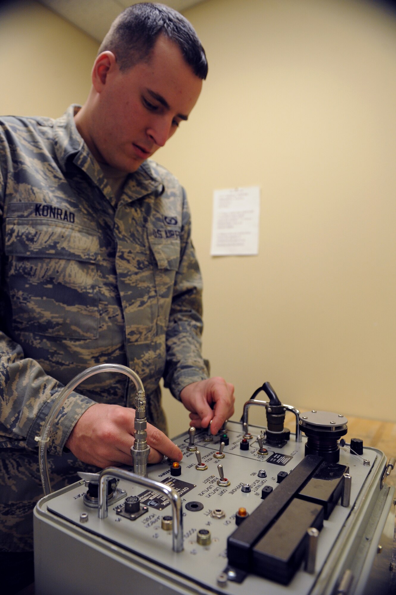 Airman 1st Class Jason Konrad, 2nd Operations Support Squadron aircrew flight equipment, uses an oxygen mask test unit to test a piece of equipment on Barksdale Air Force Base, La., Jan. 15. The machine is used to test aircrew equipment for leaks and simulates an altitude of up to 48,000 feet. (U.S. Air Force photo/Airman 1st Class Benjamin Gonsier)
