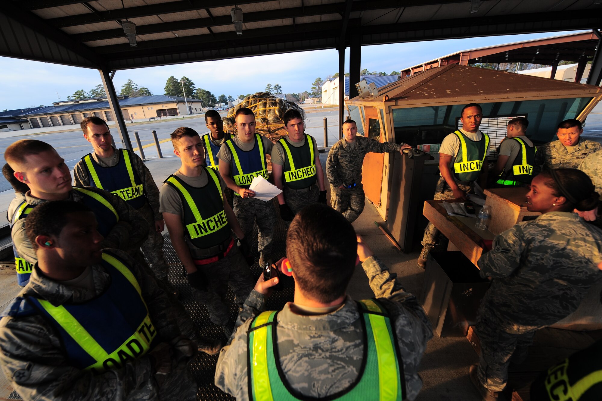 U.S. Air Force Airmen assigned to the 4th Fighter Wing are briefed by Capt. Kregg Smith, 4th Logistics Readiness Squadron officer in charge of cargo deployment function during Operational Readiness Exercise Coronet Warrior 13-01 on Seymour Johnson Air Force Base, N.C., Jan. 14, 2013. During the ORE, workload and hours increase for members of the CDF in order to ensure mission success. (U.S. Air Force photo/Airman 1st Class Aubrey White/Released)