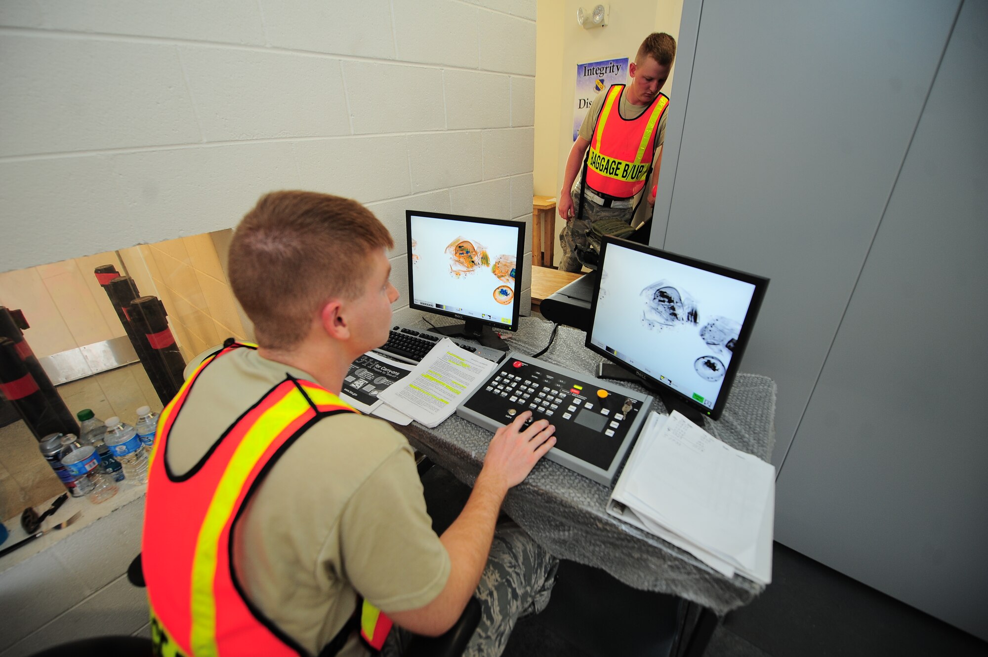 U.S. Air Force Airman 1st Class Bradley Snyder, 4th Equipment Maintenance Squadron munitions support equipment maintainer, reviews gear scanned by an X-ray machine at the Personnel Deployment Facility on Seymour Johnson Air Force Base, N.C., Jan. 14, 2013. Snyder inspected the gear for liquids, weapons or anything seemingly suspicious. (U.S. Air Force photo/Airman 1st Class Aubrey White/Released)