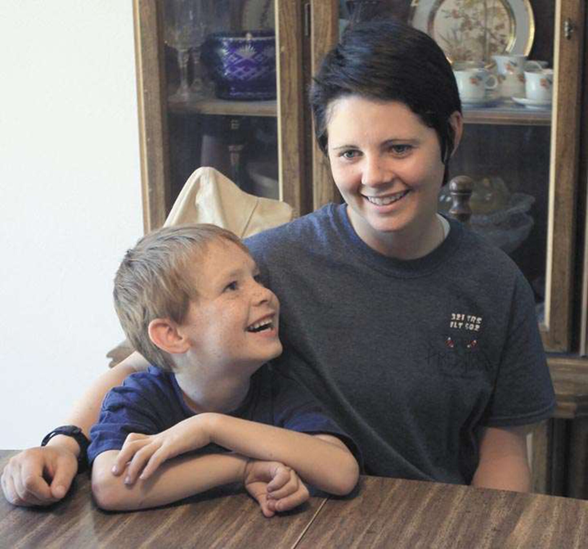 Airman Basic Shelby Goff sits with her 6-year-old brother, Amadeaus Foster, at their home in Grand Junction, Colo. She used CPR to save him after a near drowning at a motel swimming pool in San Antonio. (Courtesy photo by Dean Humphrey, The Daily Sentinel)