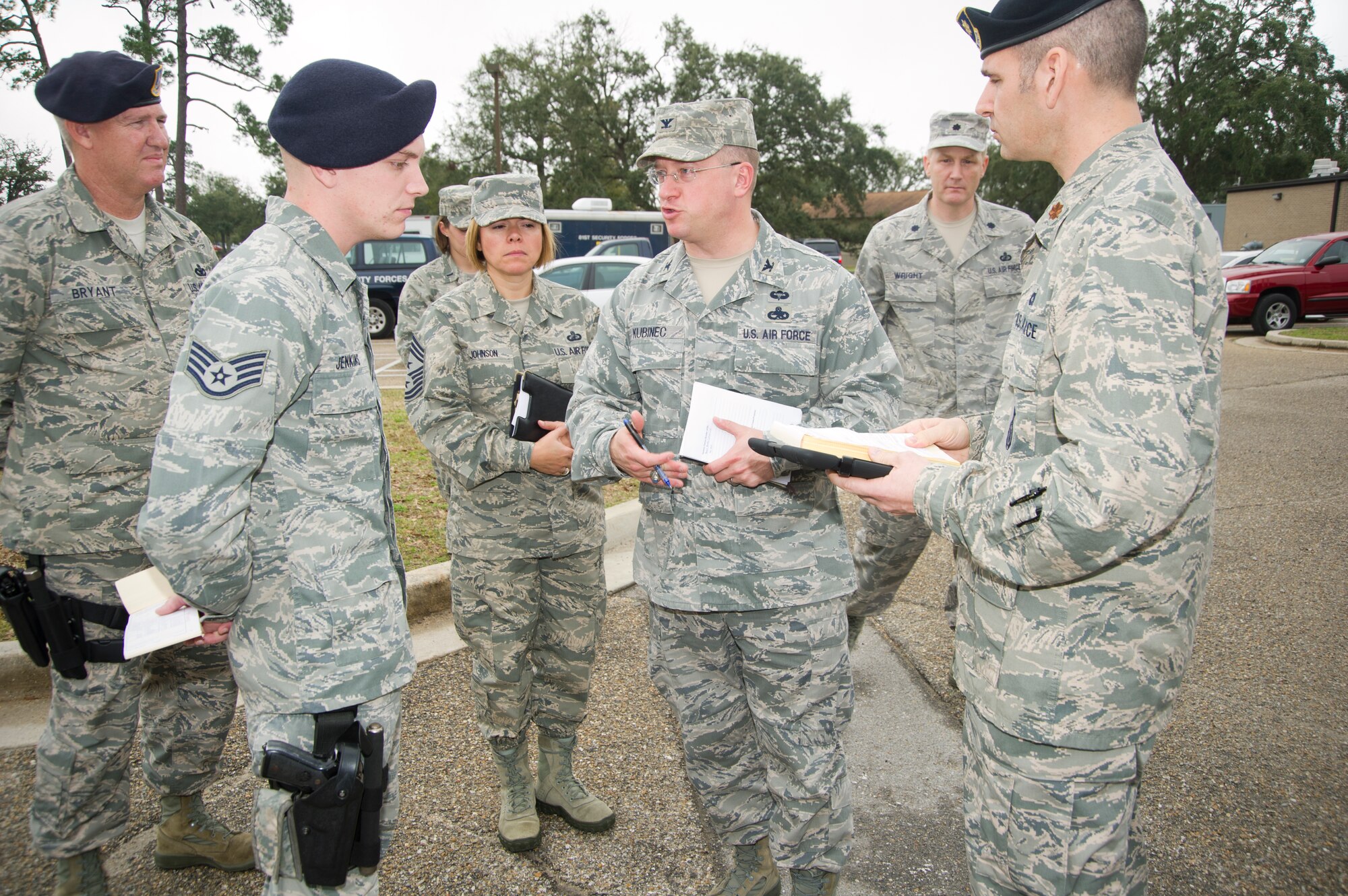Col. John Kubinec, Installation Excellence Selection Board member, participates in a discussion with 81st Security Forces members, on the forms and procedures involved in security checks at Keesler Air Force Base, Miss., Jan. 10, 2013. Keesler is one of the top two bases competing for the Commander-in-Chief's Annual Award for Installation Excellence with a $1 million top prize for quality of life initiatives. Keesler showed the board members various examples of team problem solving, unit cohesiveness and enhanced productivity throughout their two-day visit.  (U.S. Air Force photo by Adam Bond)