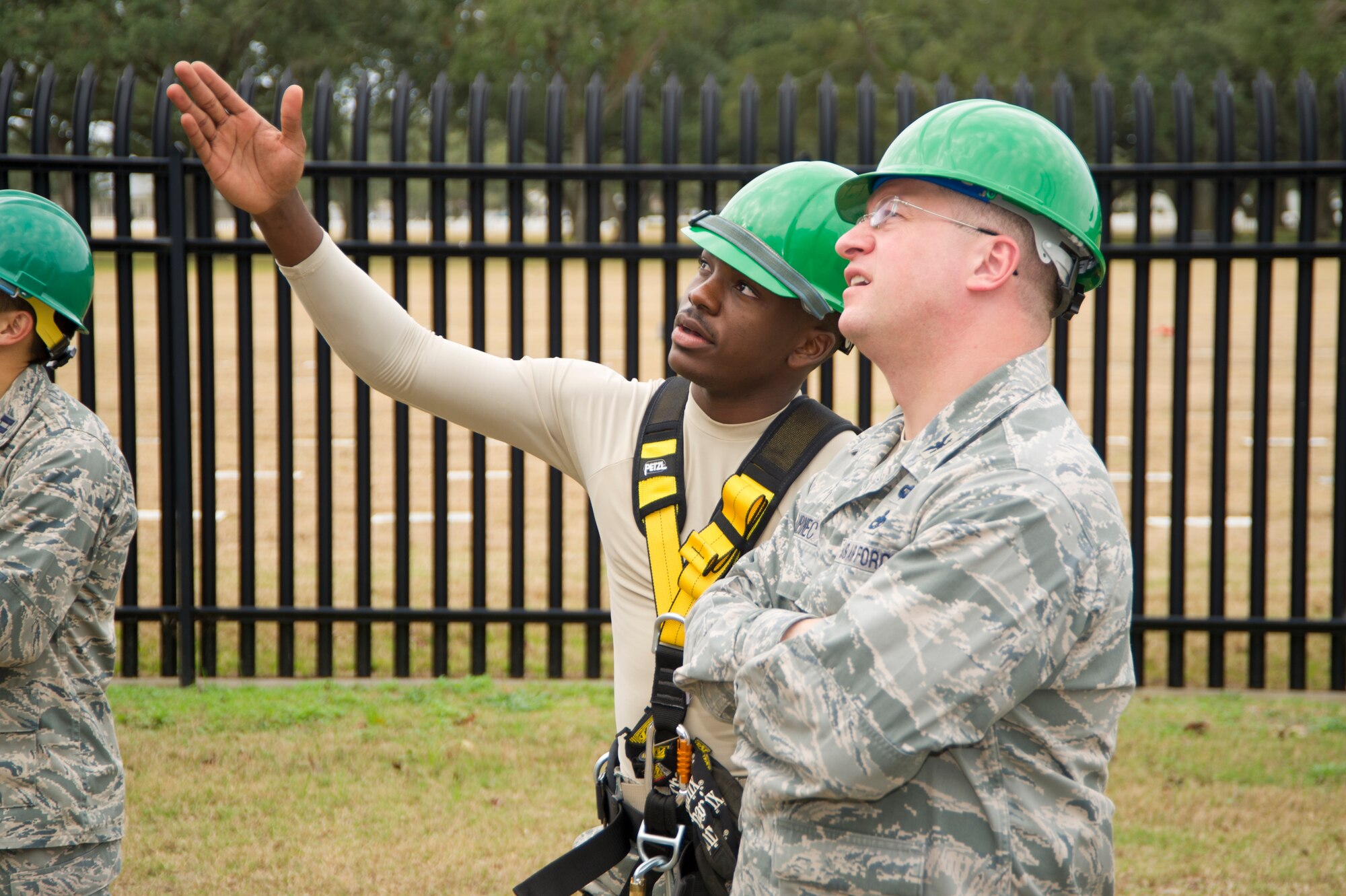 Staff Sgt. Rajab Kigembe, 85th Engineering Installation Squadron, directs the attention of Col. John Kubinec, Installation Excellence Selection Board member, to a repelling rescue demonstration during a tour of the 85th EIS Jan. 11, 2013, at Maltby Hall, Keesler Air Force Base, Miss.  Keesler is one of the top two bases competing for the Commander-in-Chief's Annual Award for Installation Excellence with a $1 million top prize for quality of life initiatives. Keesler showed the board members various examples of team problem solving, unit cohesiveness and enhanced productivity throughout their two-day visit.  (U.S. Air Force photo by Adam Bond)