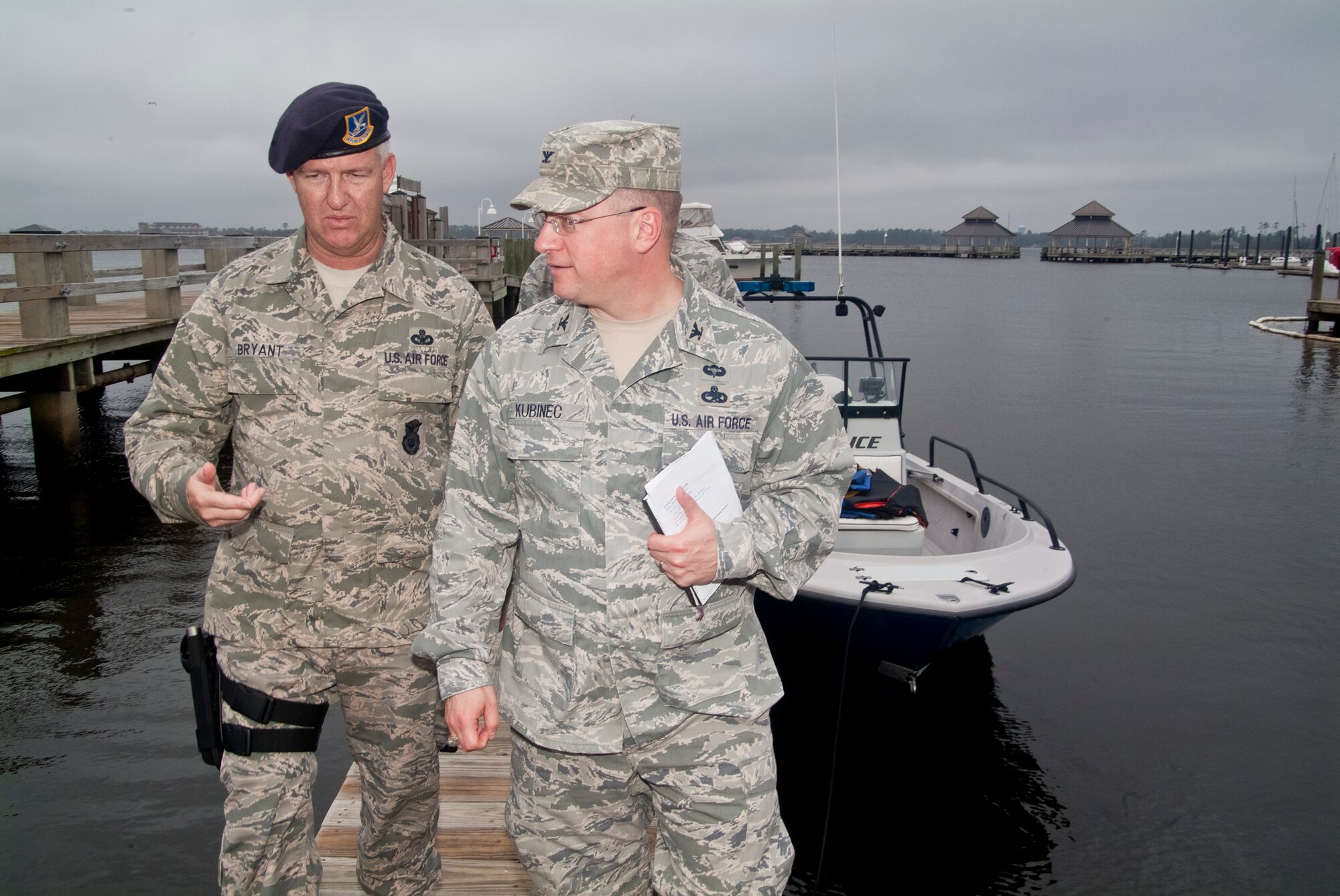Chief Master Sgt. Jeffery Bryant, 81st Security Forces Squadron, and Col. John Kubinec, Installation Excellence Selection Board member, walk down a pier next to the boat ramp at Keesler’s marina during a tour of the marina and the 81st SFS’s water craft Jan. 10, 2013, at Keesler Air Force Base, Miss.  Keesler is one of the top two bases competing for the Commander-in-Chief's Annual Award for Installation Excellence with a $1 million top prize for quality of life initiatives. Keesler showed the board members various examples of team problem solving, unit cohesiveness and enhanced productivity throughout their two-day visit.  (U.S. Air Force photo by Herb Welch)