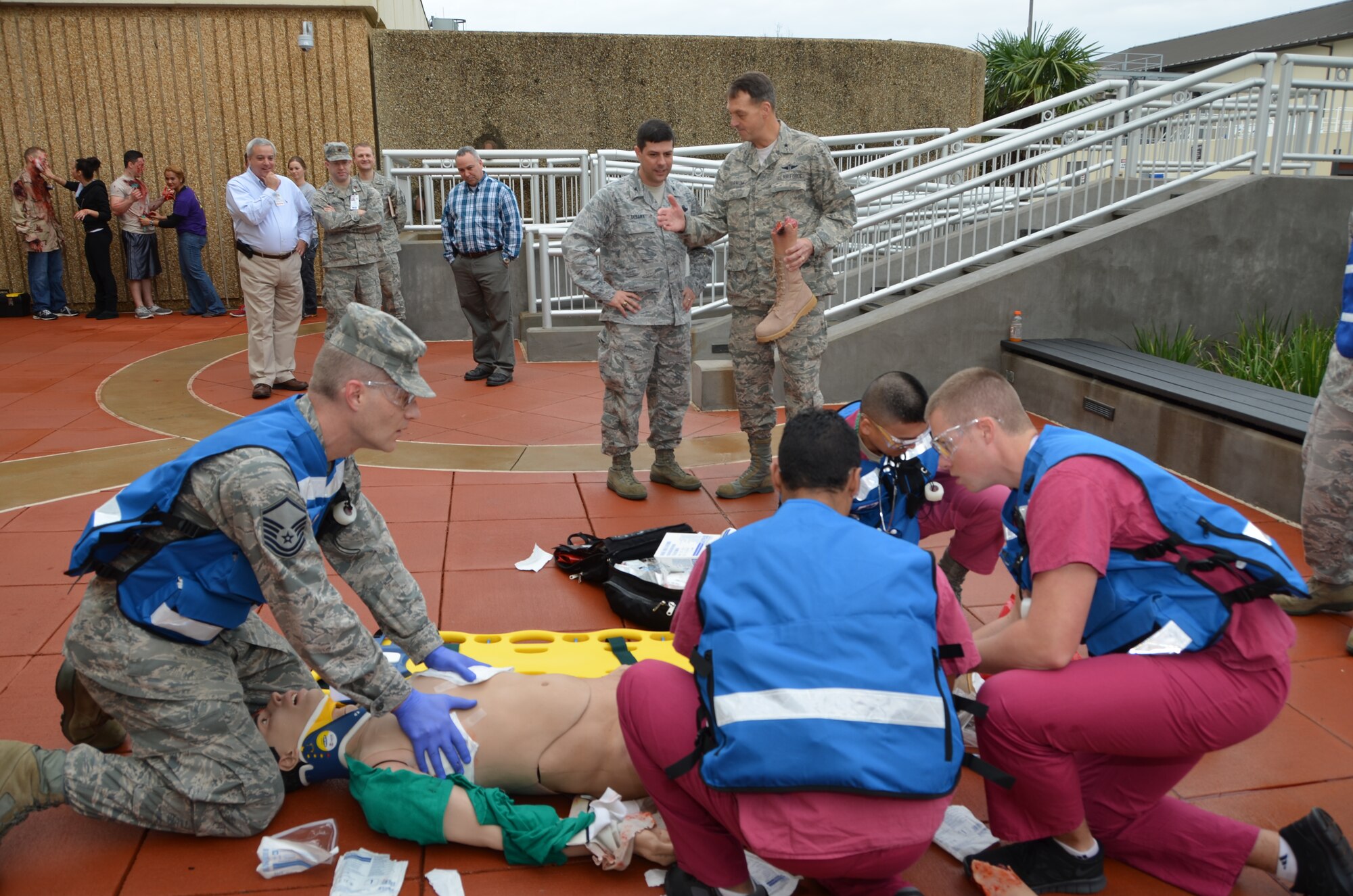 A first-responder medical team treats an amputation victim with a patient simulator during a demonstration for Col. Andrew Gebara, Installation Excellence Selection Board member, as Brig. Gen. (Dr.) Kory Cornum, 81st Medical Group commander, right, explains the event at the Keesler Hospital Jan. 11, 2013, Keesler Air Force Base, Miss.  Keesler is one of the top two bases competing for the Commander-in-Chief's Annual Award for Installation Excellence with a $1 million top prize for
quality of life initiatives. Keesler showed the board members various examples of team problem solving, unit cohesiveness and enhanced productivity throughout their two-day visit.  (U.S. Air Force photo by Steve Pivnick)