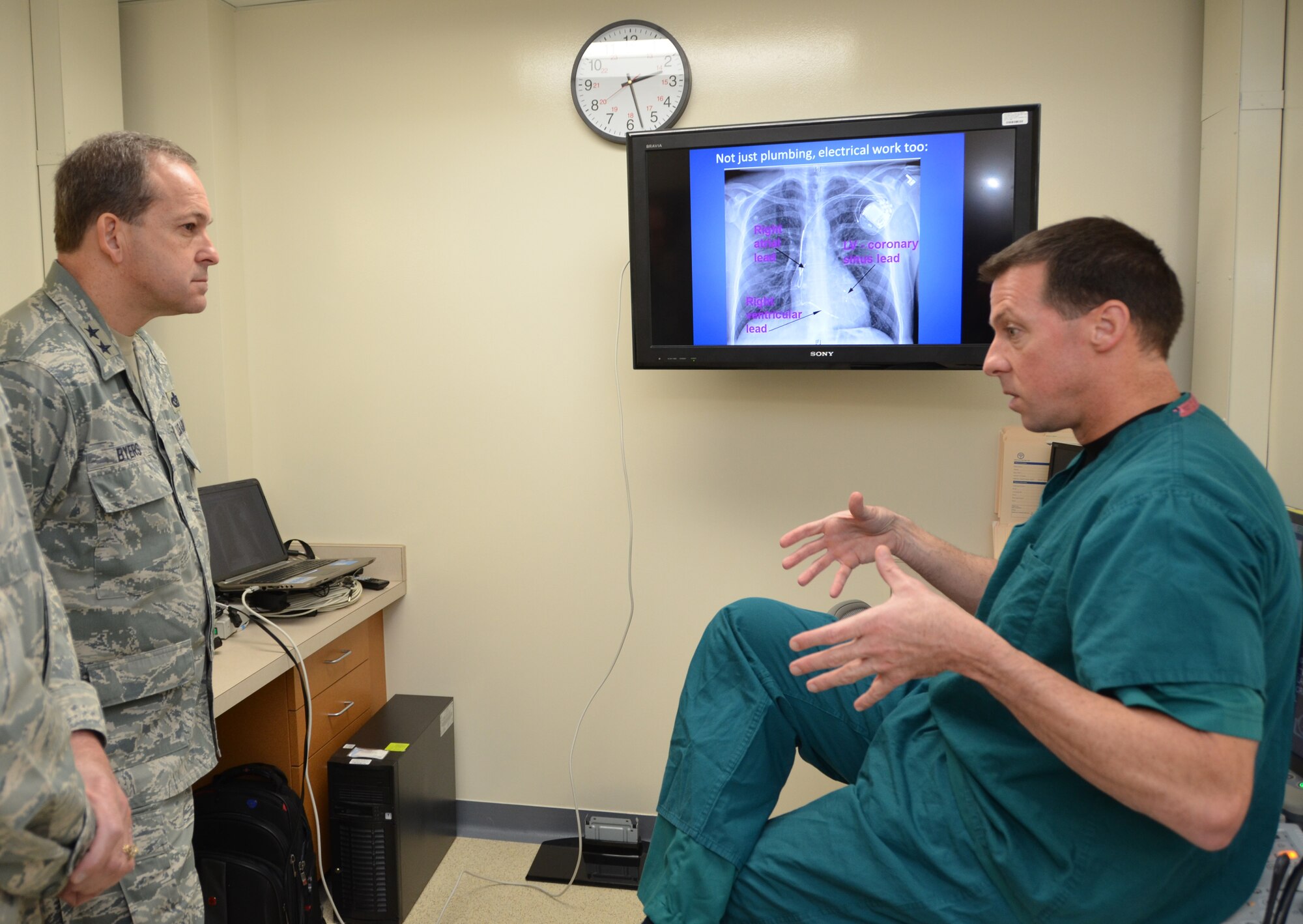 Lt. Col. (Dr.) Steve Kindsvater, commander of the 81st Medical Operations Squadron’s Cardiovascular/Pulmonary Flight, right, explains cardiac resynchronization therapy which helps synchronize heart function to Maj. Gen. Timothy Byers, the Air Force Civil Engineer and Installation Excellence Selection Board member, in the Keesler Hospital’s new cardiac cath lab Jan. 10, 2013, Keesler Air Force Base, Miss. Keesler is one of the top two bases competing for the Commander-in-Chief's Annual Award for Installation Excellence with a $1 million top prize for quality of life initiatives. Keesler showed the board members various examples of team problem solving, unit cohesiveness and enhanced productivity throughout their two-day visit.  (U.S. Air Force photo by Steve Pivnick)