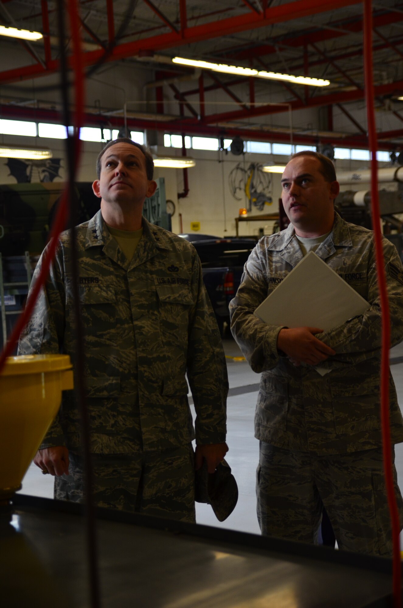 Staff Sgt. Benjamin Johnson, 81st Logistics Readiness Squadron material control, explains a waste oil burner used to heat the vehicle maintenance building with old oil from government vehicles to Maj. Gen. Tim Byers, the Air Force Civil Engineer and Installation Excellence Selection Board member, Jan. 11, 2013, at Keesler Air Force Base, Miss.  Keesler is one of the top two bases competing for the Commander-in-Chief's Annual Award for Installation Excellence with a $1 million top prize for
quality of life initiatives.  Keesler showed the board members various examples of team problem solving, unit cohesiveness and enhanced productivity throughout their two-day visit.  (U.S. Air Force photo by Senior Airman Heather Heiney)