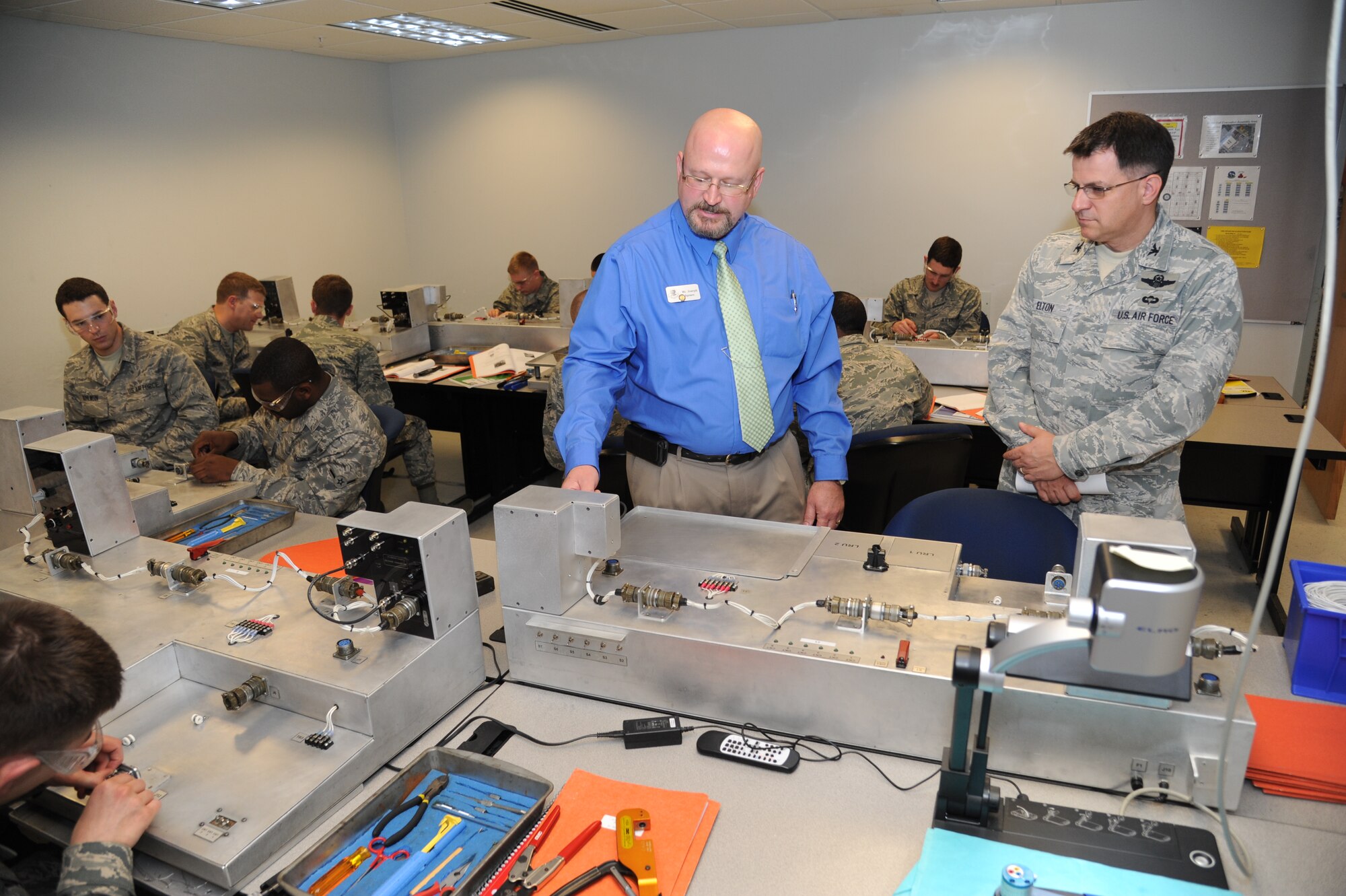 Joseph Spears, 335th Training Squadron, shows training equipment used in the Avionics Fundamentals Course to Col. Albert Elton, Installation Excellence Selection Board member, Jan. 11, 2013, at Dolan Hall, Keesler Air Force Base, Miss.  Keesler is one of the top two bases competing for the Commander-in-Chief's Annual Award for Installation Excellence, with a $1 million top prize for quality of life initiatives.  Keesler showed the board members various examples of team problem solving, unit cohesiveness and enhanced productivity throughout their two-day visit.  (U.S. Air Force photo by Kemberly Groue)