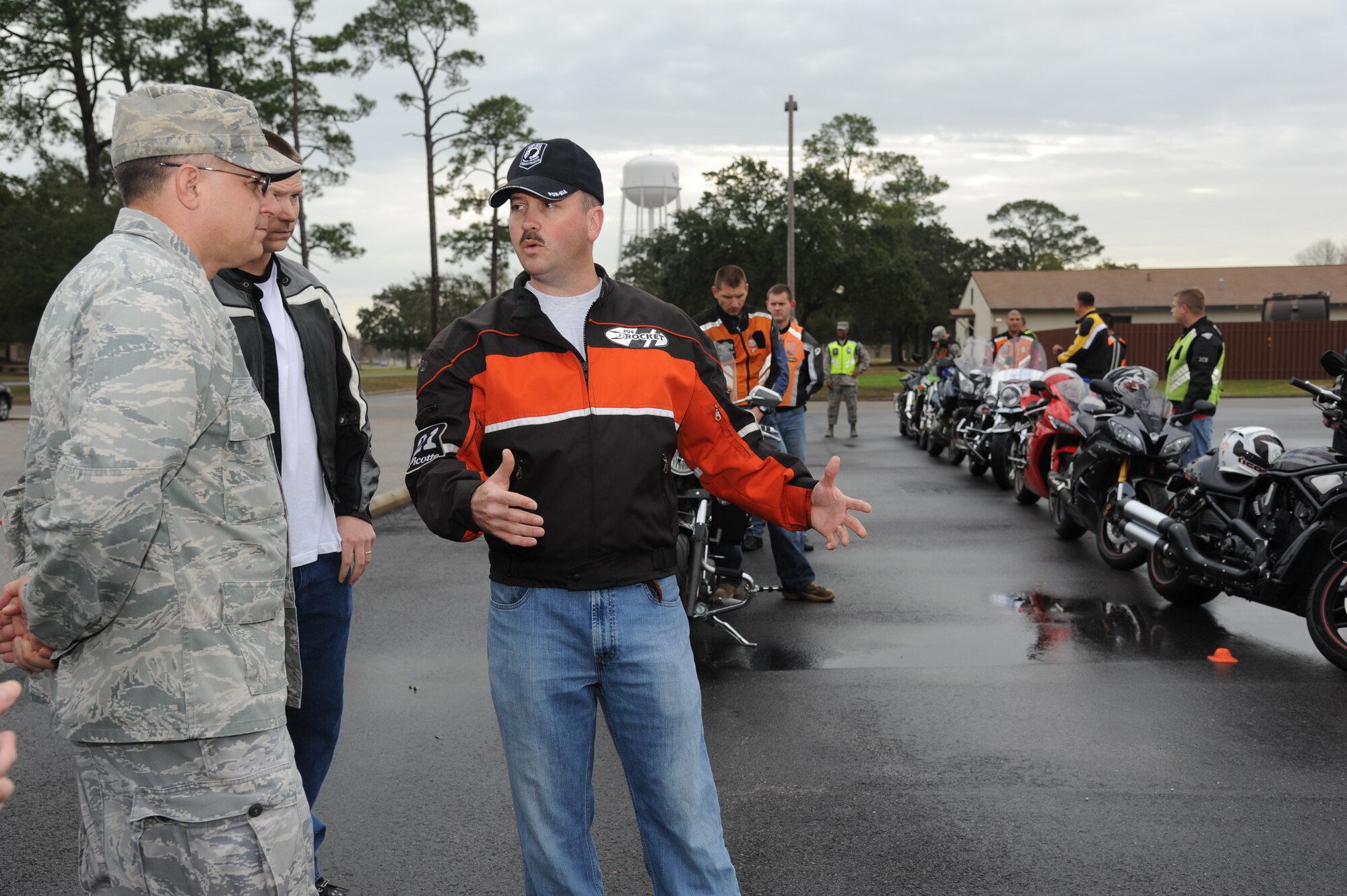 Col. Albert Elton, Installation Excellence Selection Board member, receives a briefing on Keesler’s motorcycle safety course from Tech. Sgt. Michael Farmer, 338th Training Squadron, Jan. 11, 2013, at the course in front of Dolan Hall, Keesler Air Force Base, Miss.  Keesler is one of the top two bases competing for the Commander-in-Chief's Annual Award for Installation Excellence, with a $1 million top prize for quality of life initiatives.  Keesler showed the board members various examples of team problem solving, unit cohesiveness and enhanced productivity throughout their two-day visit.  (U.S. Air Force photo by Kemberly Groue)