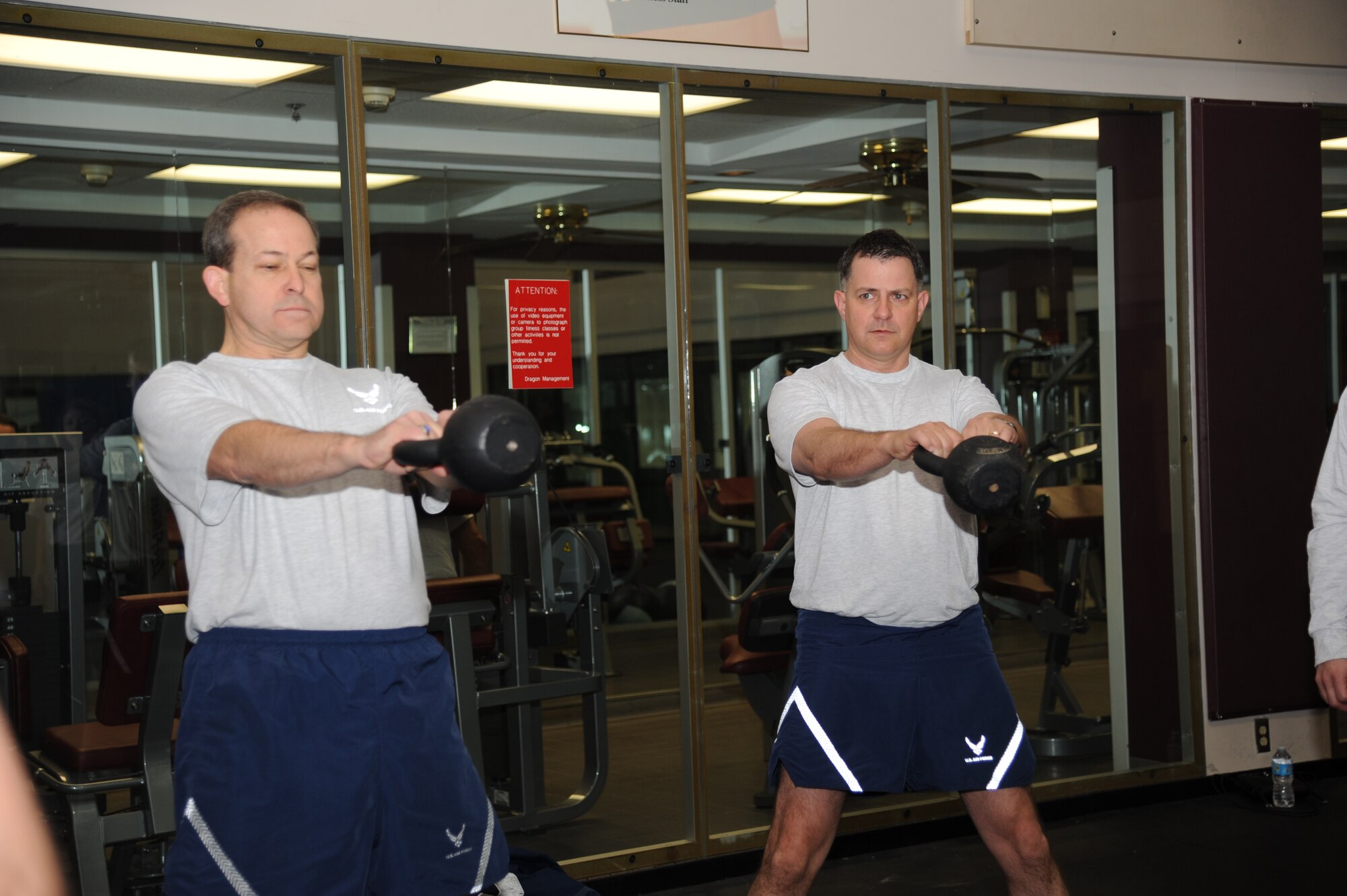 Maj. Gen. Timothy Byers, left, and Col. Albert Elton, Installation Excellence Selection Board members, work out with kettle bells at the Warfighter Fitness Court Jan. 11, 2013, at the Dragon Fitness Center, Keesler Air Force Base, Miss. The IESB visited the two finalist bases to evaluate how well the base improved work environments, quality of life and increased customer satisfaction to determine the winner of the Commander-in-Chief's Annual Award for Installation Excellence.  The first-place base wins $1 million towards quality of life initiatives while the second-place base earns $500,000.  (U.S. Air Force photo by Kemberly Groue)