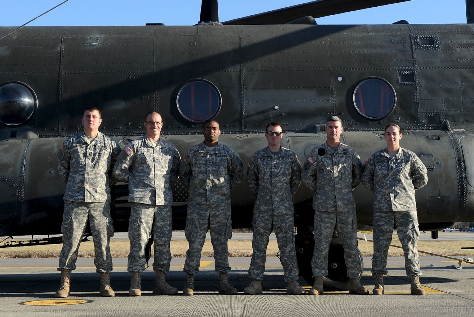 Soldiers from the Army Reserve's 5th Battalion, 159th Aviation Regiment, stand with a CH-47 Chinook at Fort Eustis, Va., Jan. 10, 2013. The battalion is currently serving in the Defense CBRN Response Force, a task force established to support relief efforts following catastrophic terrorist or natural disaster events. (U.S. Air Force photo by Staff Sgt. Ashley Hawkins/Released)