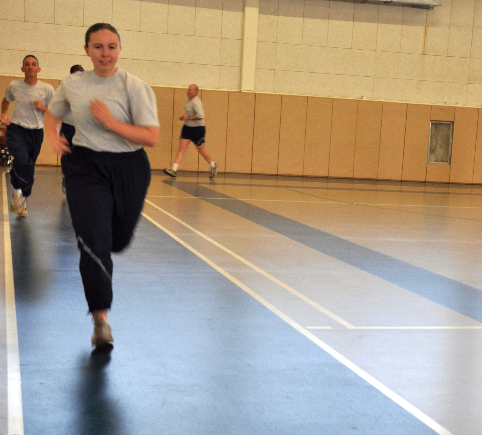 GOODFELLOW AIR FORCE BASE, Texas – Senior Airman Lorelei McCann, 17th Training Support Squadron cyber systems operations, runs a lap around the gym at the Carswell Field House here, Jan. 14. Participants of the circuit training run a lap between each round of the circuit training that was held that day. (U.S Air Force photo/ Airman 1st Class Joshua Edwards)