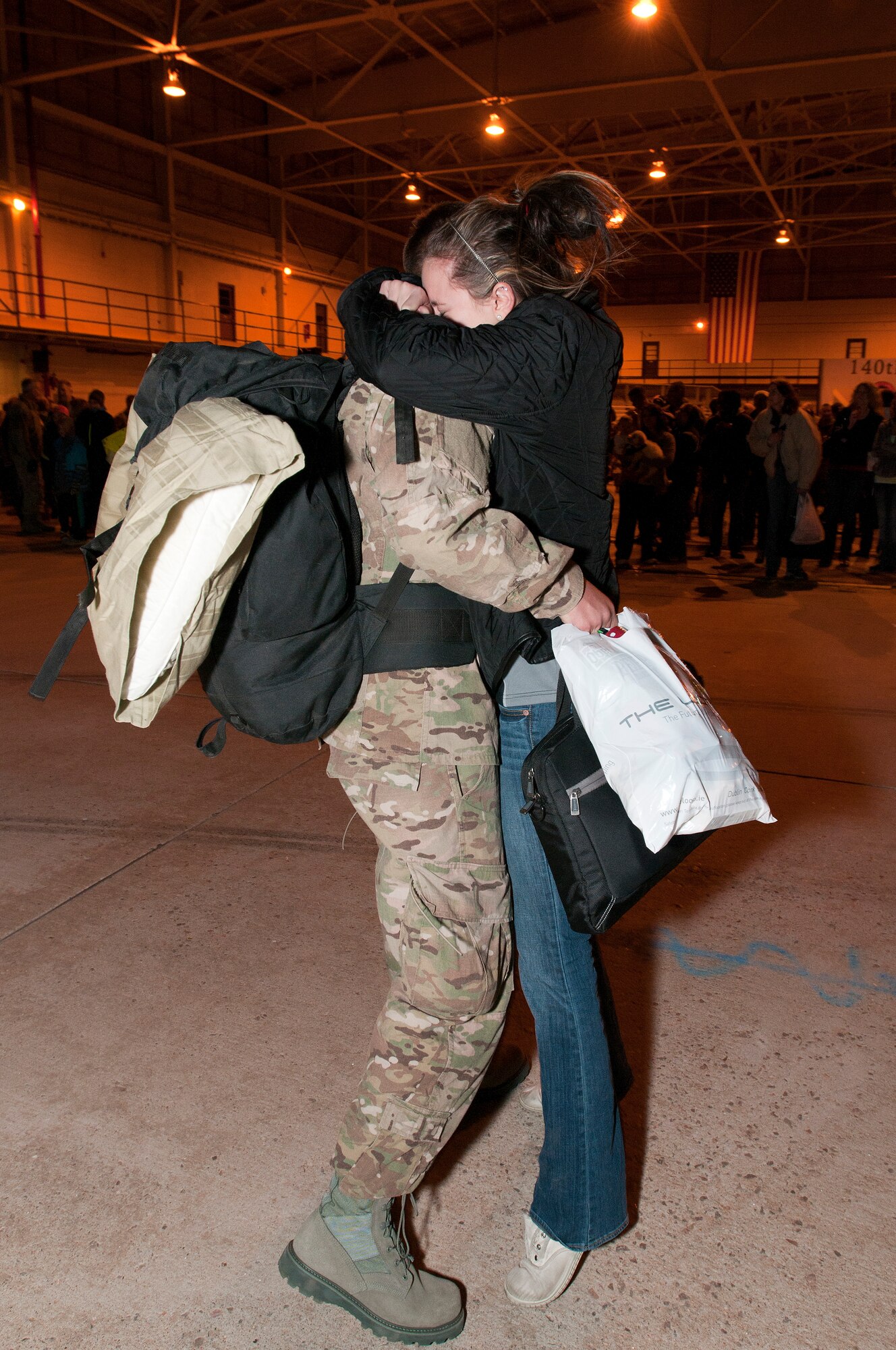 Family members of the returning Airmen anxiously await the 140th Wing members' arrival in the middle of the night Jan. 9 at Buckley AFB, Colo. (Air National Guard Photo by Tech. Sgt Wolfram Stumpf)