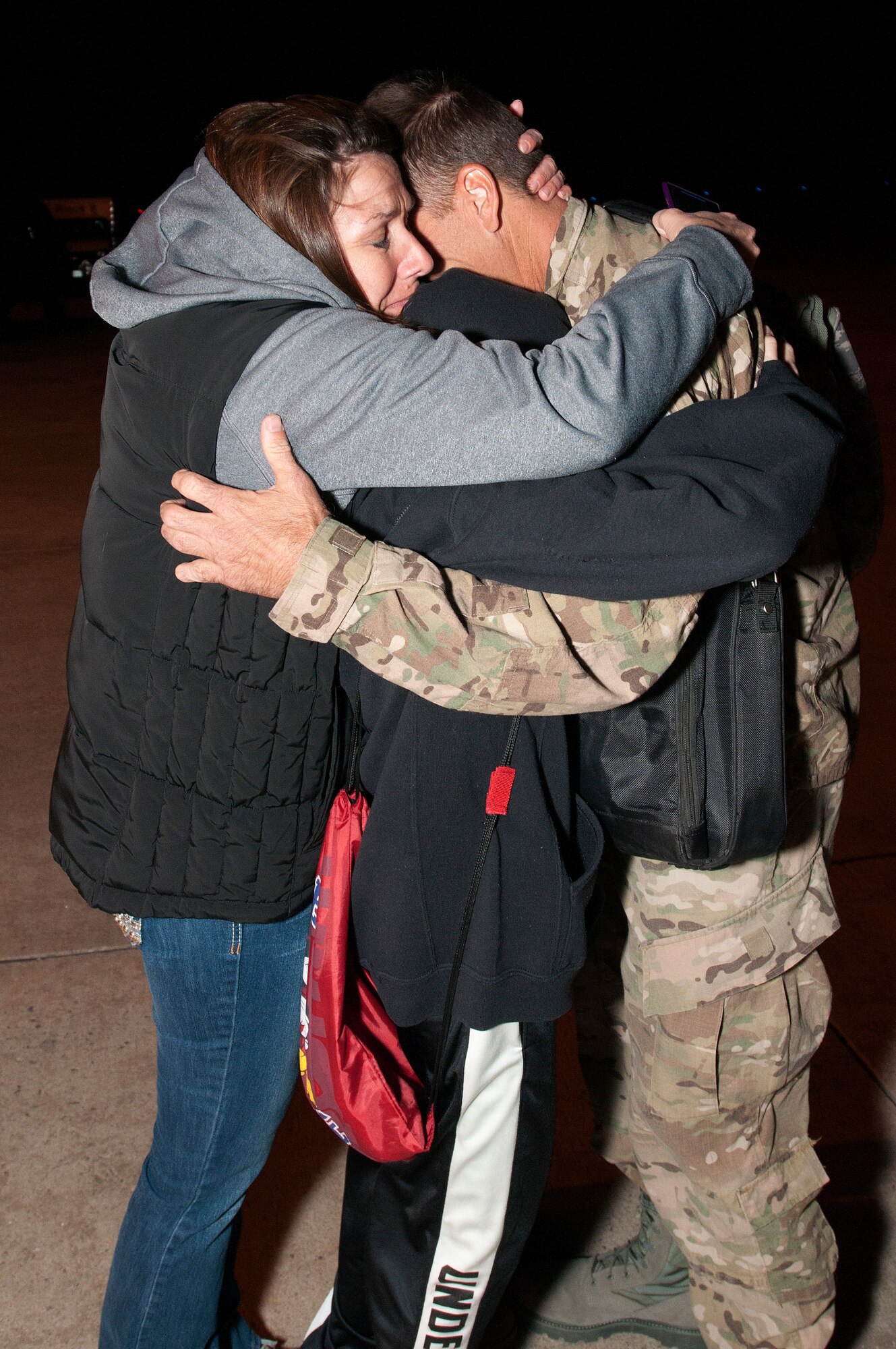 Family members of the returning Airmen anxiously await the 140th Wing members' arrival in the middle of the night Jan. 9 at Buckley AFB, Colo. (Air National Guard Photo by Tech. Sgt Wolfram Stumpf)