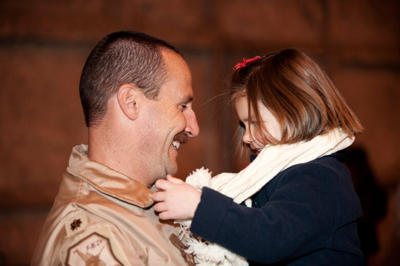 Family members of the returning Airmen anxiously await the 140th Wing members' arrival in the middle of the night Jan. 9 at Buckley AFB, Colo. (Air National Guard Photo by Tech. Sgt Wolfram Stumpf)