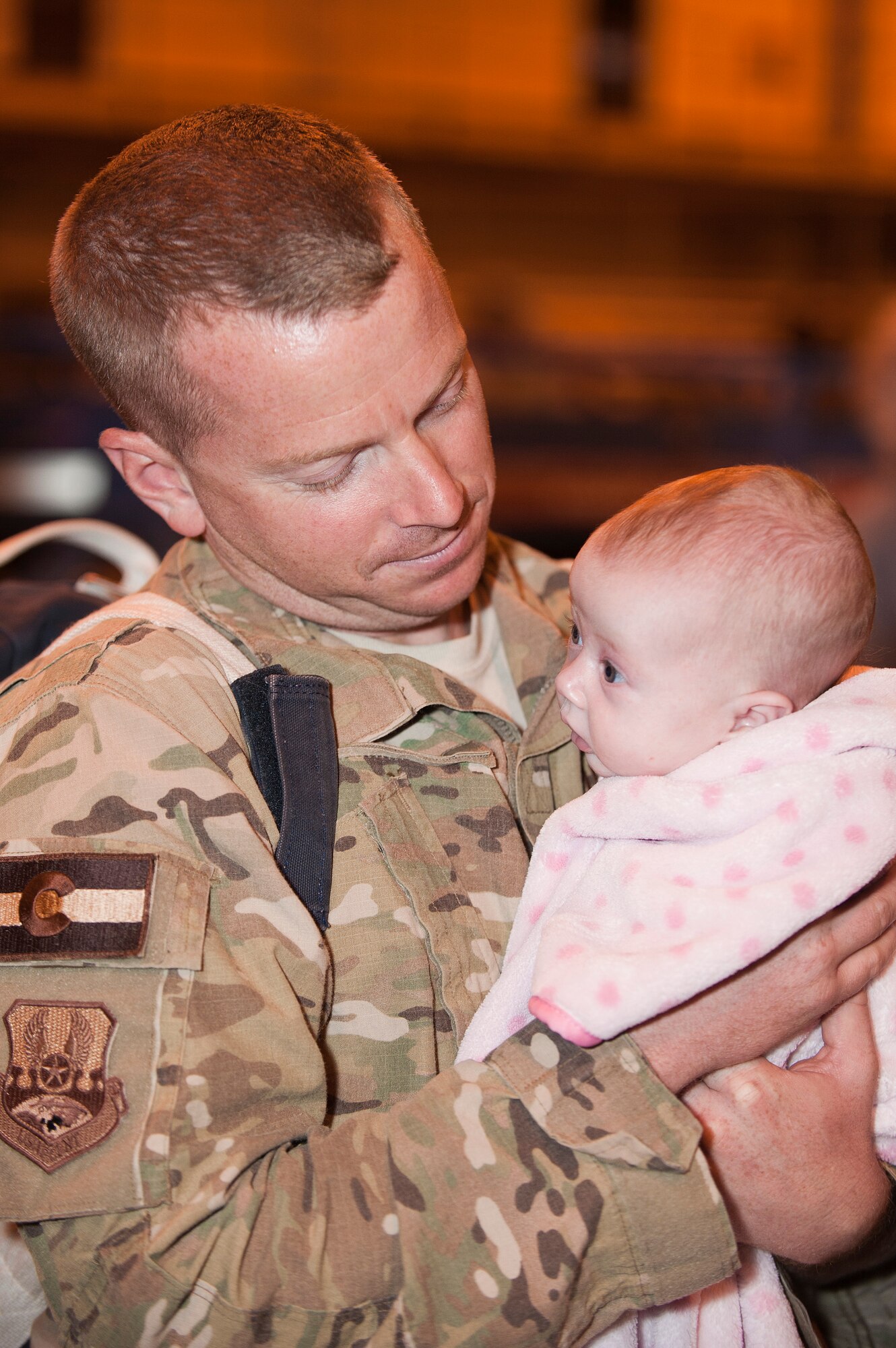 Family members of the returning Airmen anxiously await the 140th Wing members' arrival in the middle of the night Jan. 9 at Buckley AFB, Colo. (Air National Guard Photo by Tech. Sgt Wolfram Stumpf)