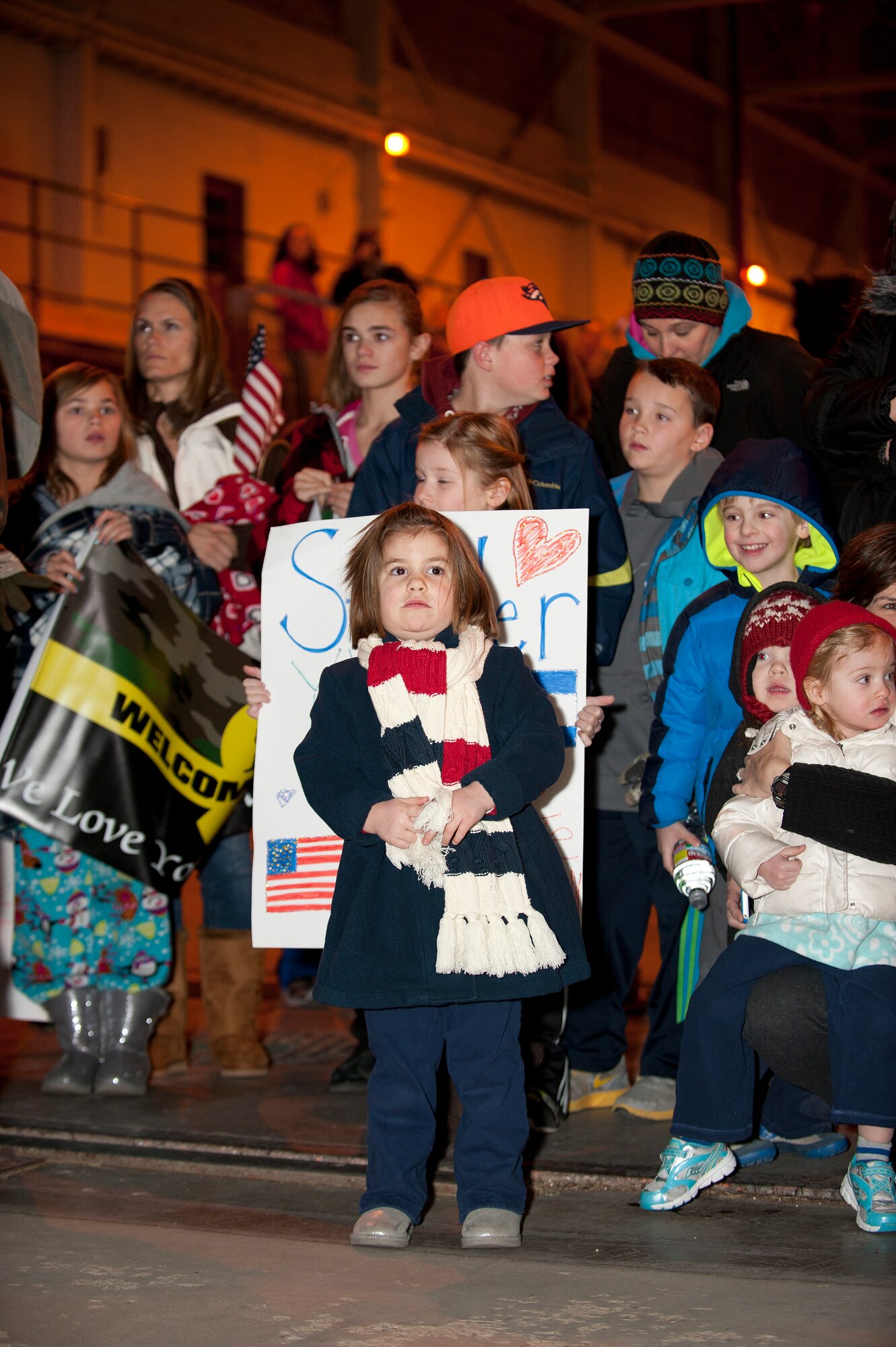 Family members of the returning Airmen anxiously await the 140th Wing members' arrival in the middle of the night Jan. 9 at Buckley AFB, Colo. (Air National Guard Photo by Tech. Sgt Wolfram Stumpf)