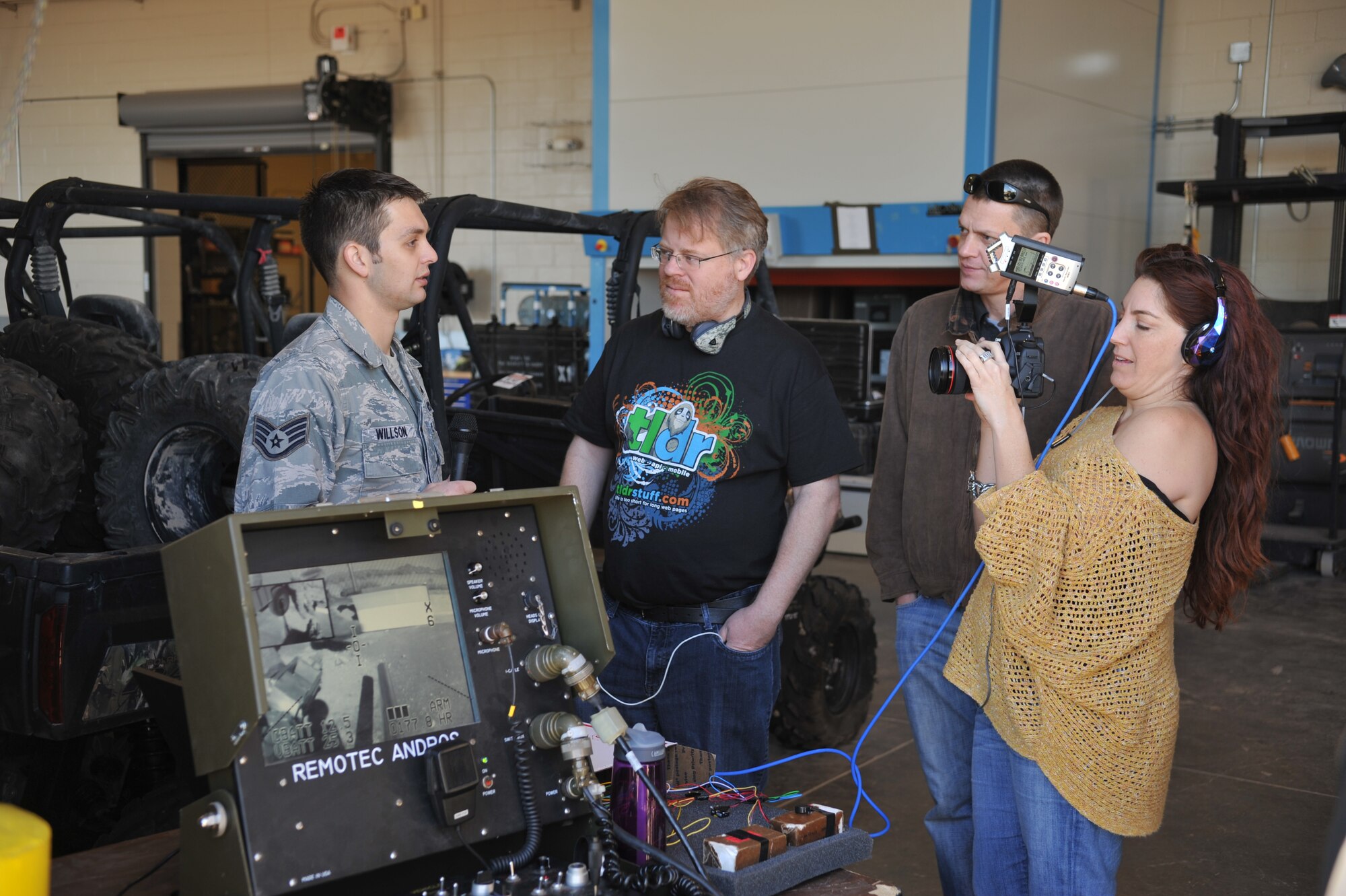 Staff Sgt. Tukker Willson, 99th Civil Engineer Squadron explosive ordnance disposal journeyman, provides an EOD mission brief to Consumer Electronics Show bloggers Jan. 11, 2013, at Nellis Air Force Base, Nev. Willson highlighted the operation control unit for the F-6 robotic platform. CES bloggers were able to see the technology that EOD members use in day to day operations and get a better understanding of the U.S. Air Force mission at Nellis. (U.S. Air Force photo by Master Sgt. David Miller)
