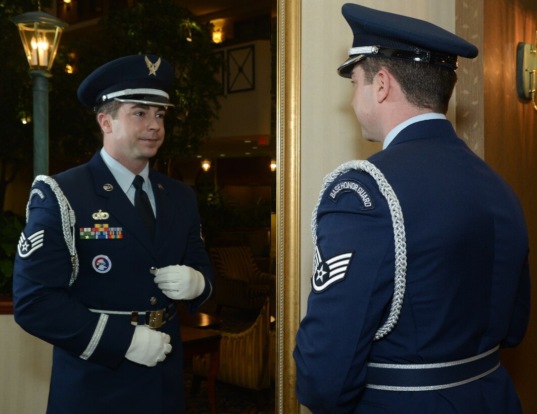 Staff Sgt. Nathan Legler, 136th Airlift Wing Honor Guard Manager of the Year, inspects himself through a mirror prior to meeting a panel of judges who will determine the best manager to represent the State of Texas in the national competition at Austin, Texas, Jan. 12, 2013. The winner will continue on to compete against active duty Air Force and Reserves. (National Guard photo by Seior Master Sgt. Elizabeth Gilbert)