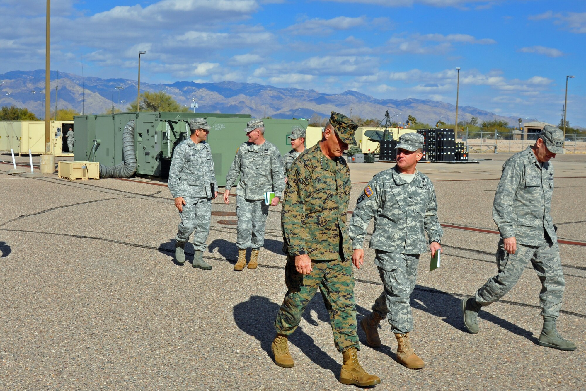 Marine Gen. John F. Kelly, U.S. Southern Command commander, talks with U.S. Army Col. David Ell, 1st Battlefield Coordination Detachment commander, at Davis-Monthan Air Force Base, Jan. 14. Kelly, who assumed his current role Nov. 19, was on his first visit to 12th AF (AFSOUTH) which serves as the air arm of USSOUTHCOM. The 1st BCD is U.S. Army South's liaison element to 12th AF (AFSOUTH), and is charged with processing ground force requests for air support and providing an exchange of current operational and intelligence data between USSOUTHCOM’s Army and Air Force components. (U.S. Air Force photo by Capt. Justin Brockhoff / Released)