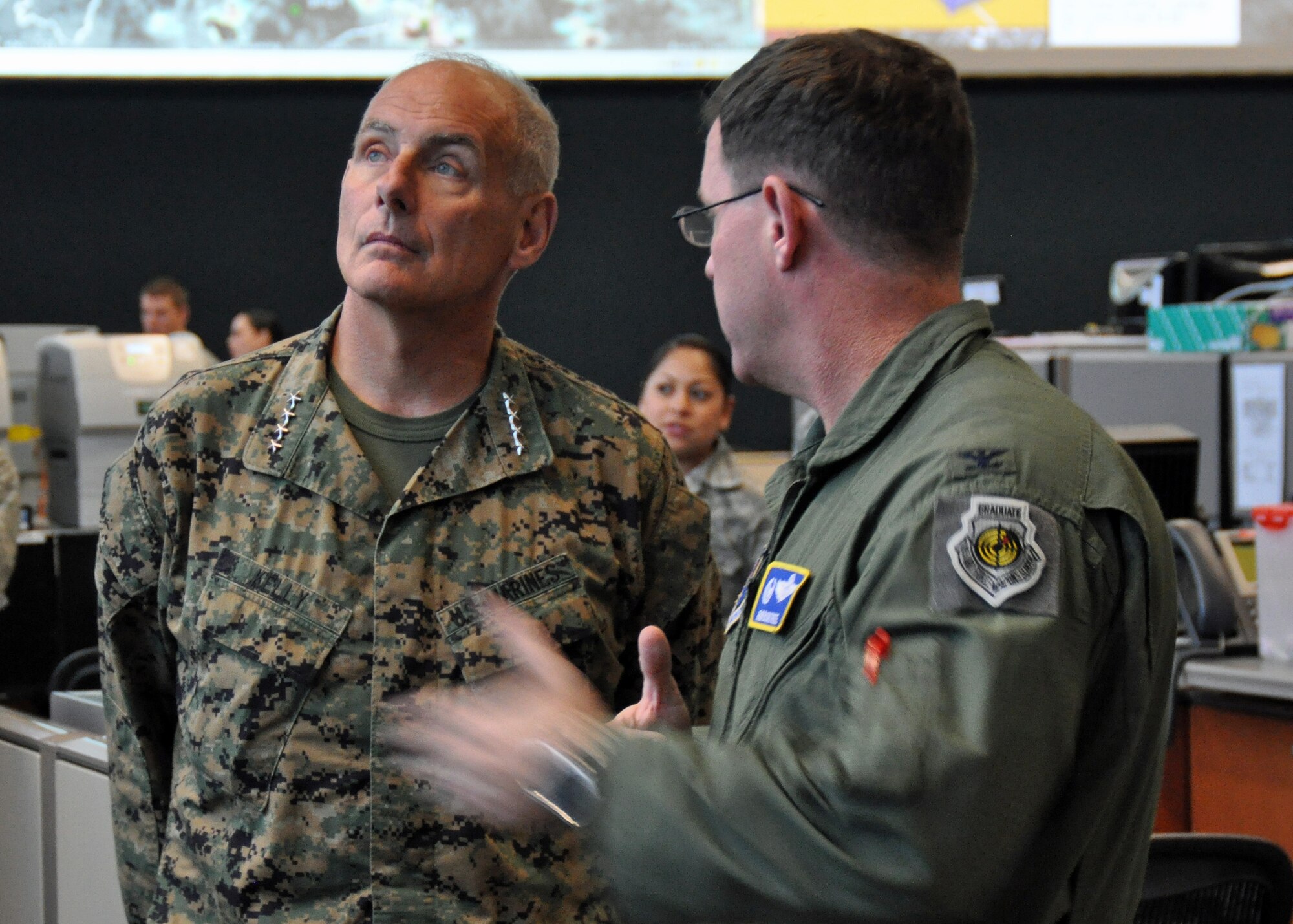 Marine Gen. John F. Kelly, U.S. Southern Command commander, discusses the mission of the 612th Air and Space Operations Center with Col. James Bortree, 612th AOC commander, at Davis-Monthan Air Force Base, Jan. 14. The 612th AOC provides command and control of air and space power in USSOUTHCOM's area of responsibility, to include 31 countries covering a sixth of the world's land mass and 559 million people. The $55 million facility, which spans 26,750 square ft., operates 24-hours-a-day to support joint and coalition efforts in the Caribbean, Central America and South America. (U.S. Air Force photo by Capt. Justin Brockhoff / Released)