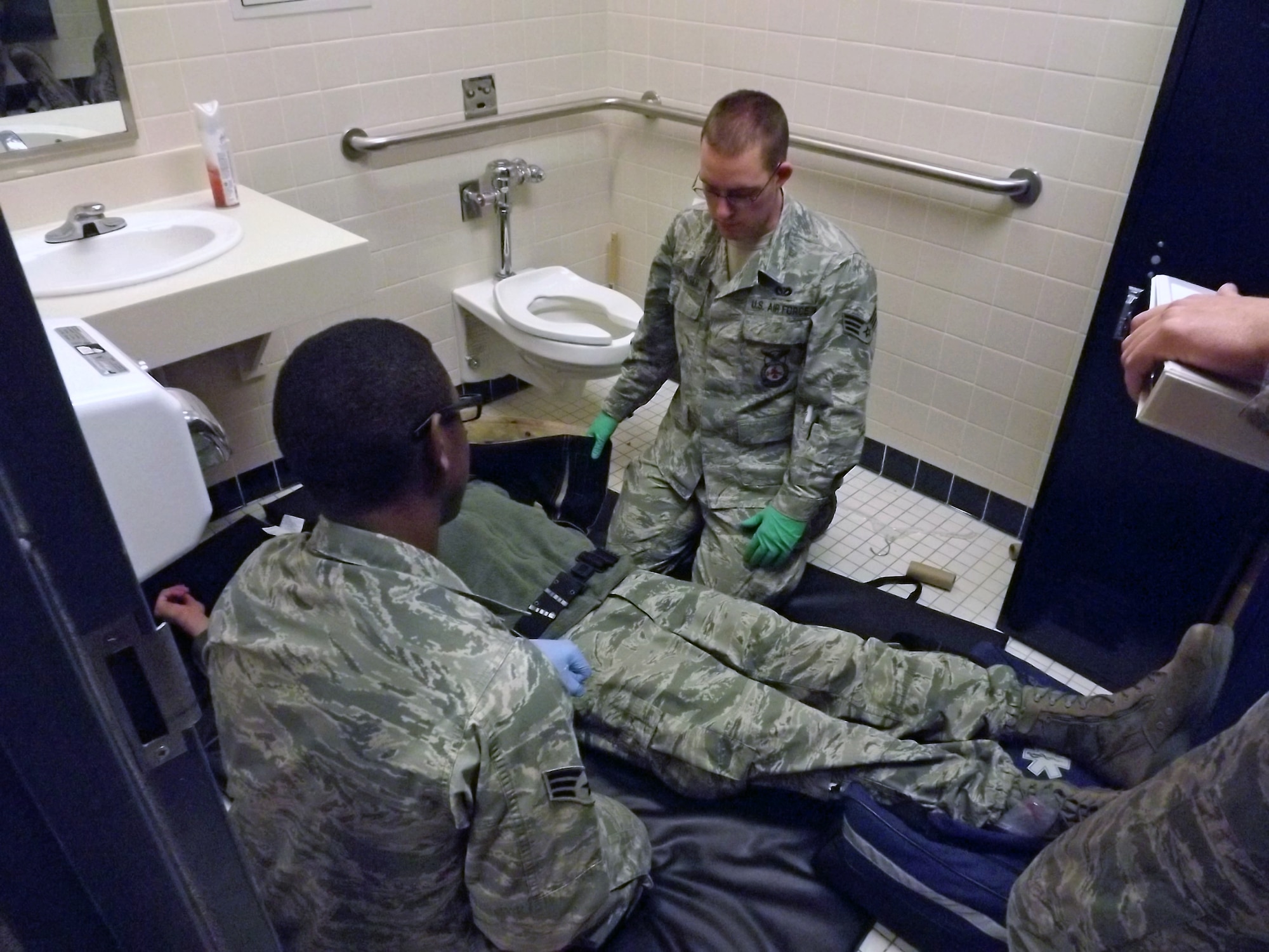 Firefighters from the 21st Civil Engineer Squadron practice giving medical attention to a trauma patient for their Emergency Medical Technician certification class Nov. 12- Dec. 21. Fifteen Airmen took the class and will be taking the National Registry of Emergency Medical Technicians exam in the coming months. (courtesy photo)