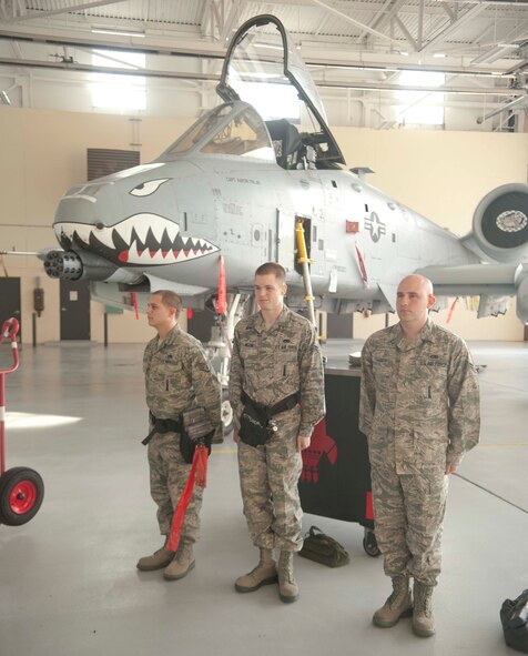 A 75th Aircraft Maintenance Unit weapons load crew awaits the signal to begin an A-10 Weapons Load Crew of the Quarter Competition at Moody Air Force Base, Ga., Jan 11, 2013.  The team consisted of three crew members who competed against a team from the 74th AMU. (U.S. Air Force photo by Airman Paul Francis/Released)

