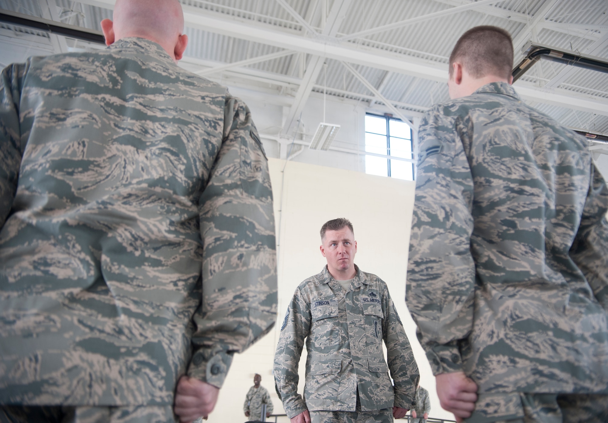 U.S. Air Force Master Sgt. Donovan Stinson, 23d Equipment Maintenance Squadron superintendent, judges two 23d Aircraft Maintenance Squadron crews from the 74th and 75th Aircraft Maintenance Units during the dress and appearance portion of an A-10 Weapons Load Crew of the Quarter Competition at Moody Air Force Base, Ga., Jan. 11, 2013. Members of each team were critiqued on their uniform, hygiene and military bearing. (U.S. Air Force photo by Airman Paul Francis/Released)
