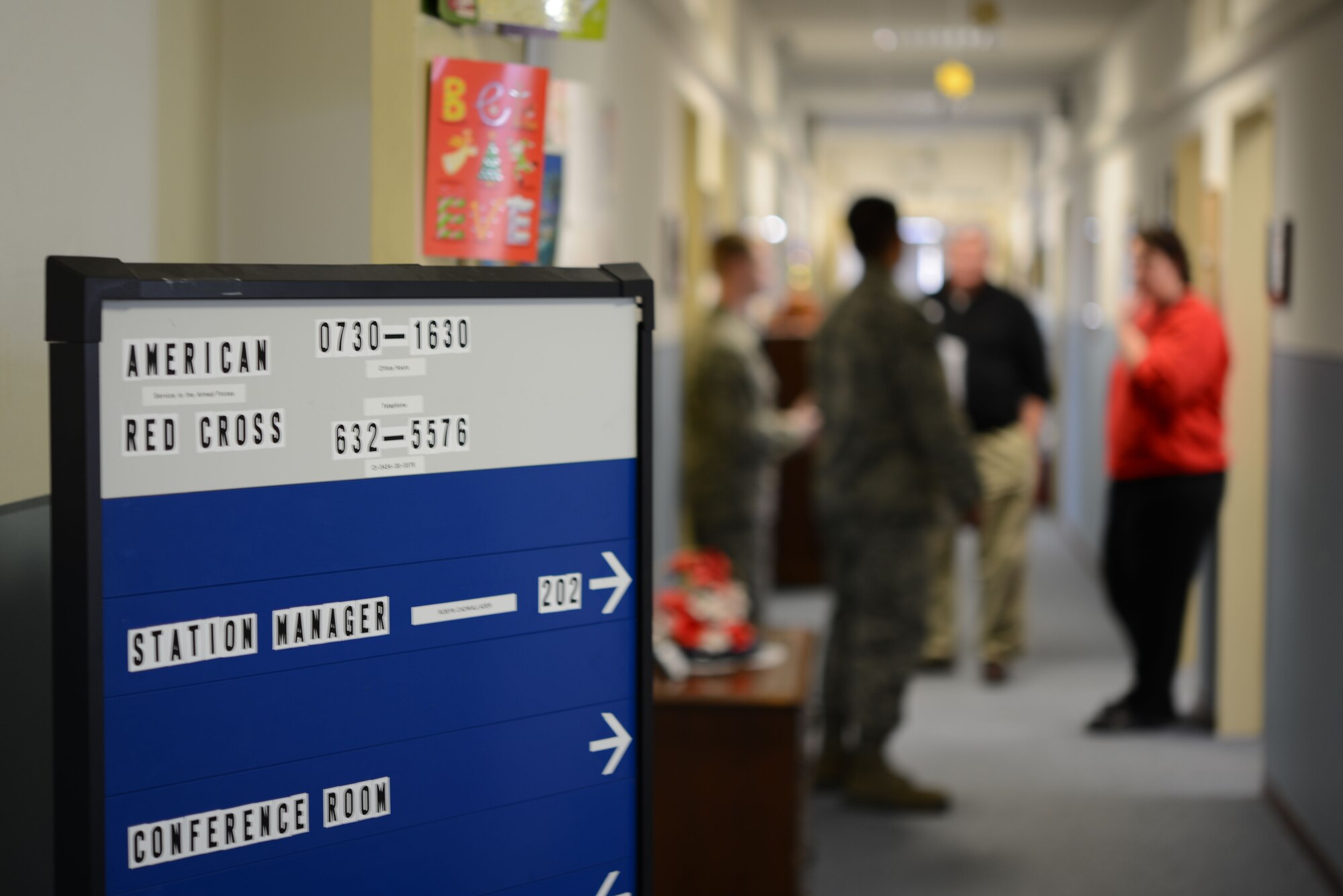 Aviano American Red Cross workers talk with Airmen Jan. 11, 2013 on Aviano Air Base, Italy. The center offers first aid, CPR, and automated external defibrillator classes among its many training and certification courses to include infant CPR, baby sitting and pet first aid. (U.S. Air Force photo/ Senior Airman Jessica Hines)